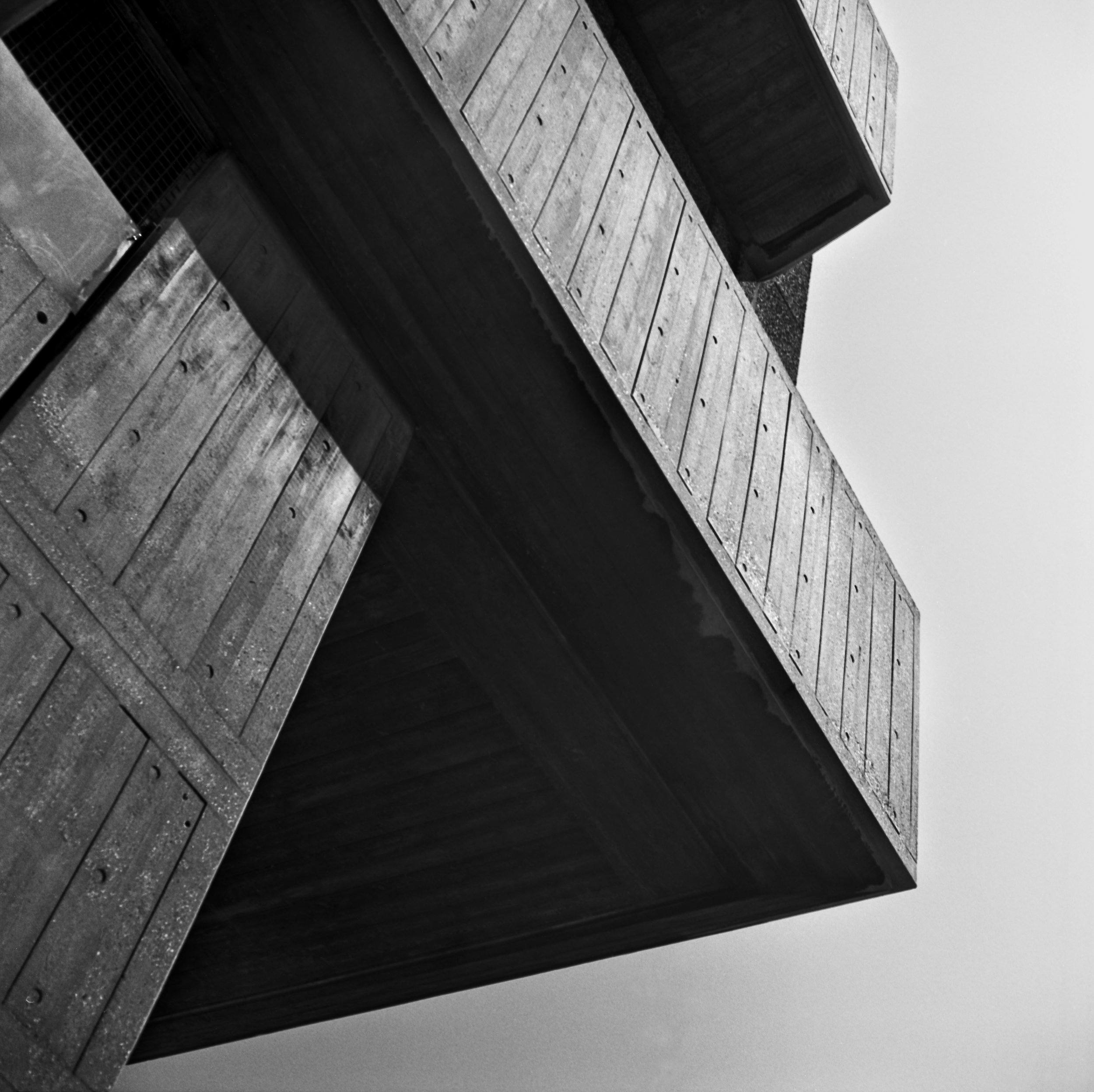 Close-up of a modern concrete building at the Southbank Centre in London, United Kingdom, with angular geometric shapes and textured surfaces, black and white photography.