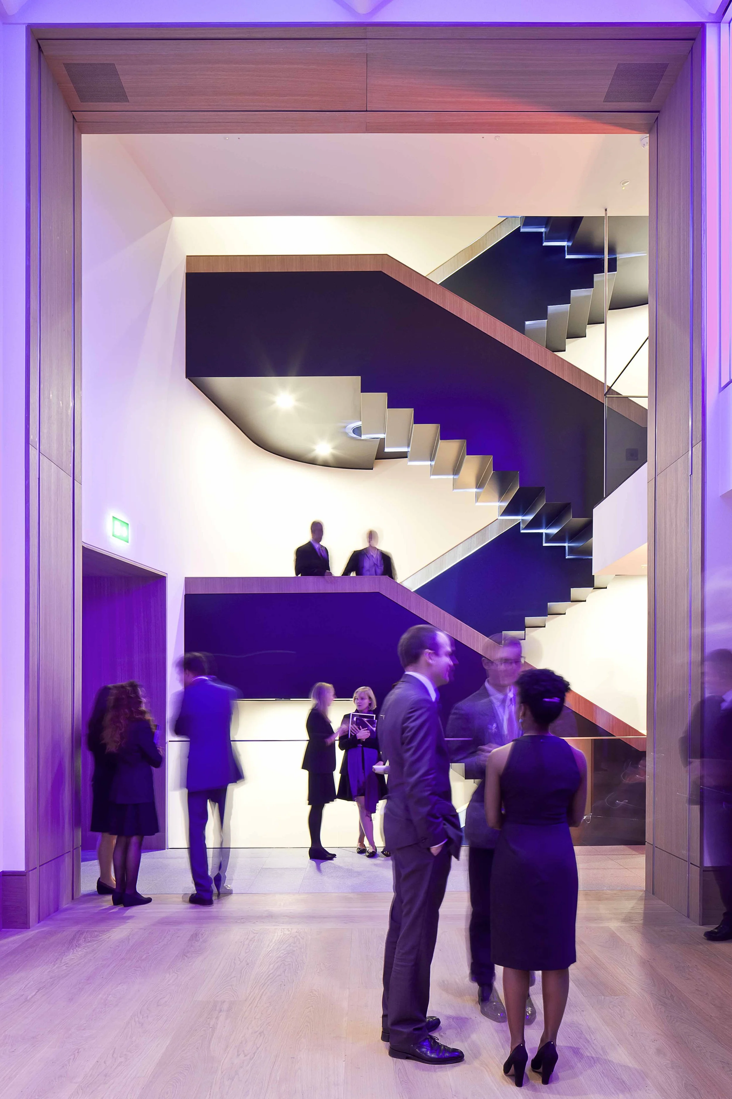 People networking at a professional event at Bonhams Auction House in London, United Kingdom.