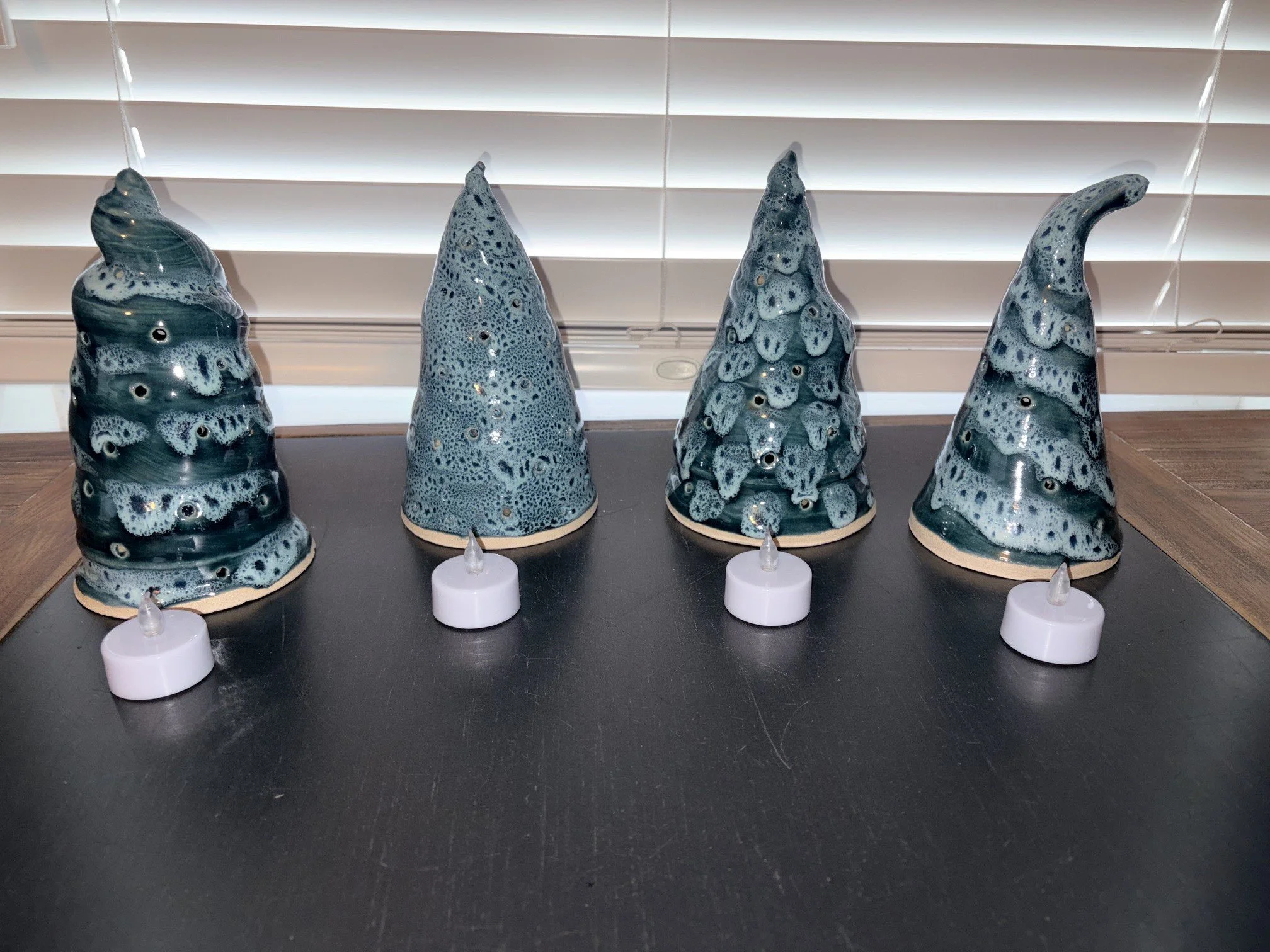 4 trees with tealights.jpg
