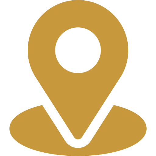 Icon of a map pin or location marker in gold color.