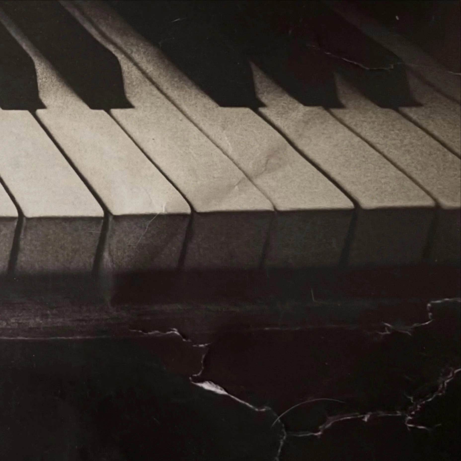 My piano which was bought over 40 years ago for my sister. #photographyexperiment. I printed the photo, dipped in salt water as I don't have that many tears to lay over the photo. When it dried the paper tore as expected. Paper reflects fragility of 
