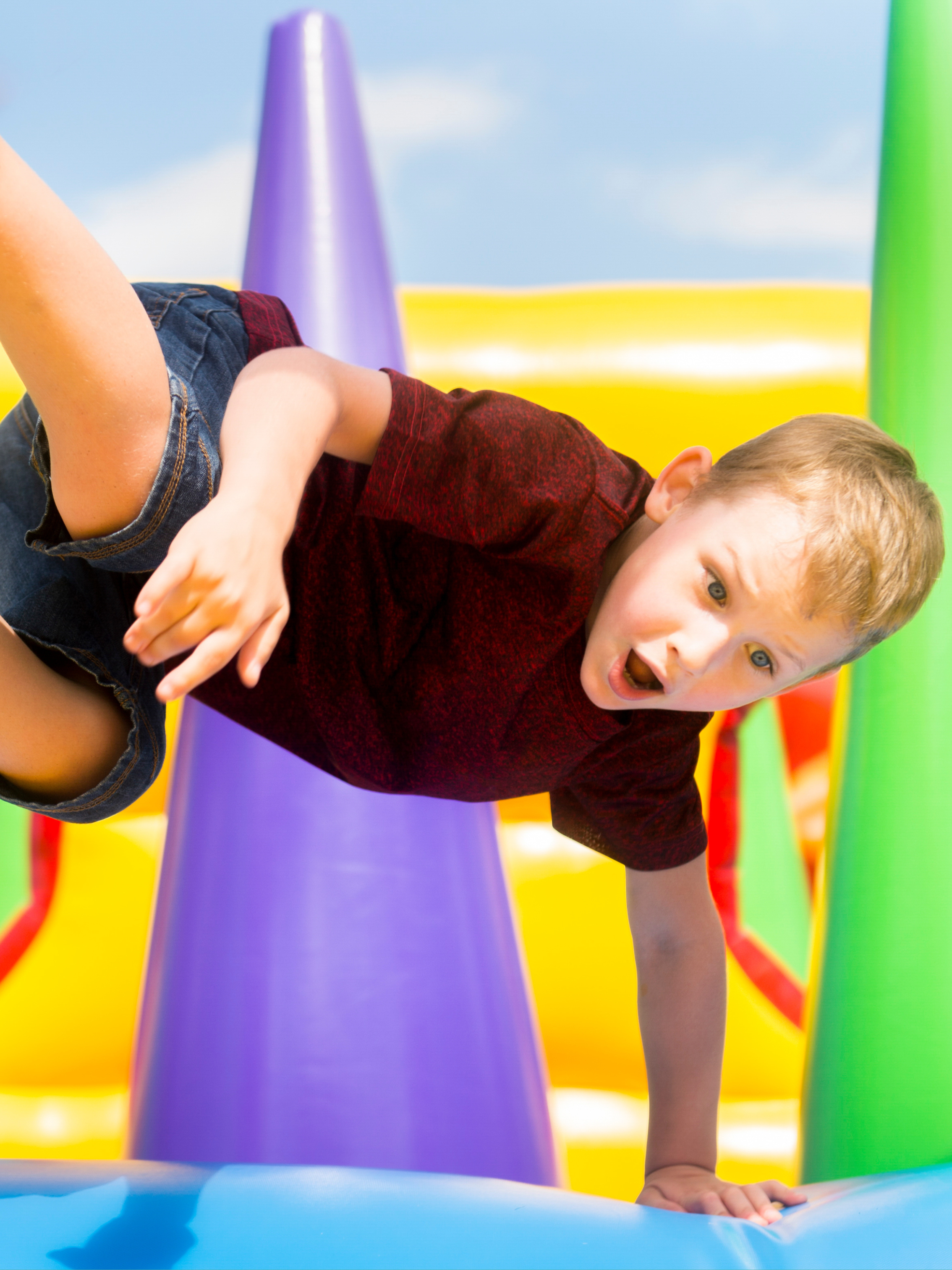 A child enjoying a bouncy castle in Cape Breton