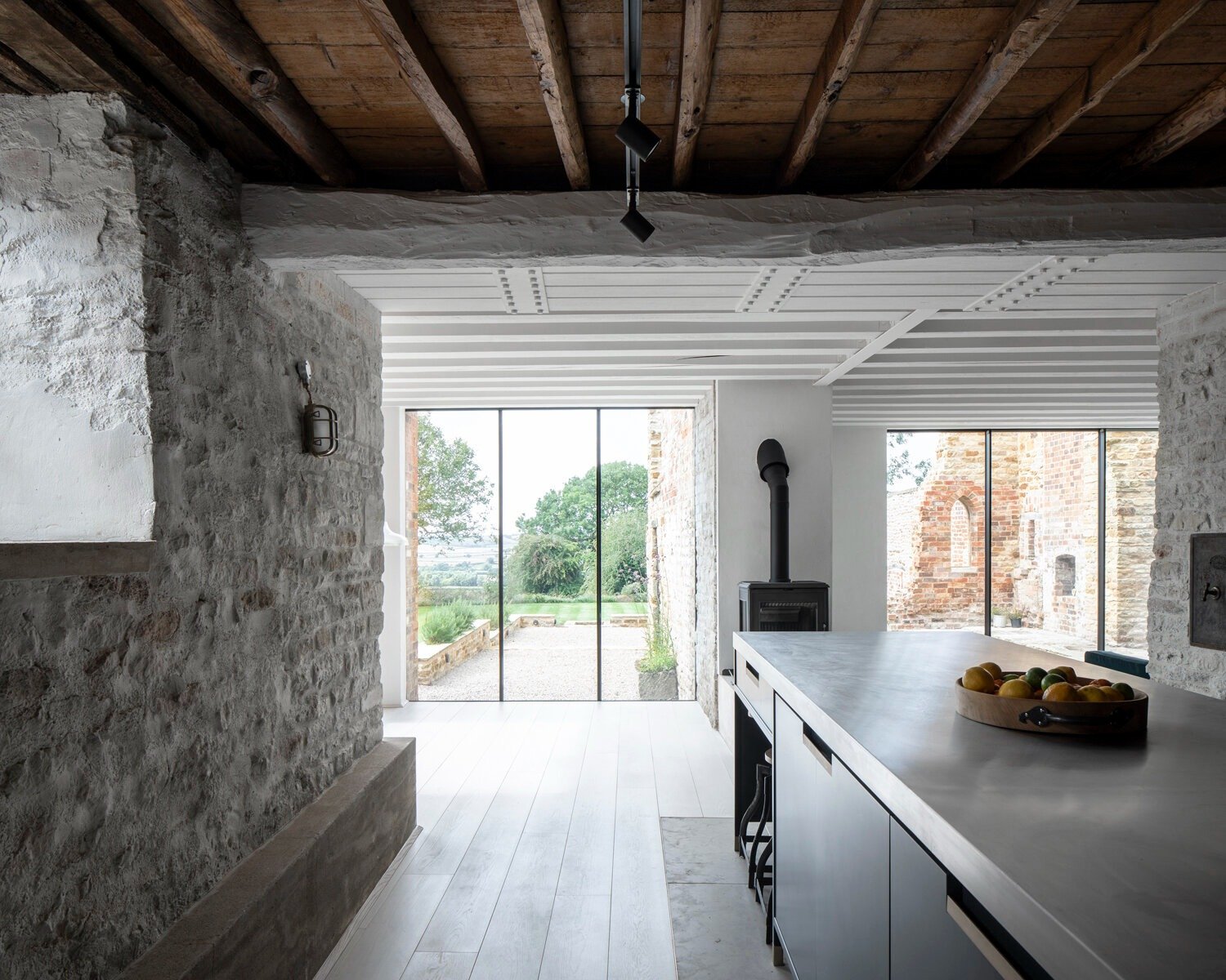 stone walled kitchen island skylight rural modern extension northamptonshire