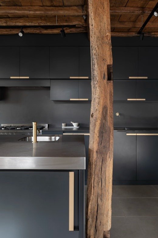 modern-industrial-kitchen-dark-cabinets-exposed-beams-parchment-works.jpg
