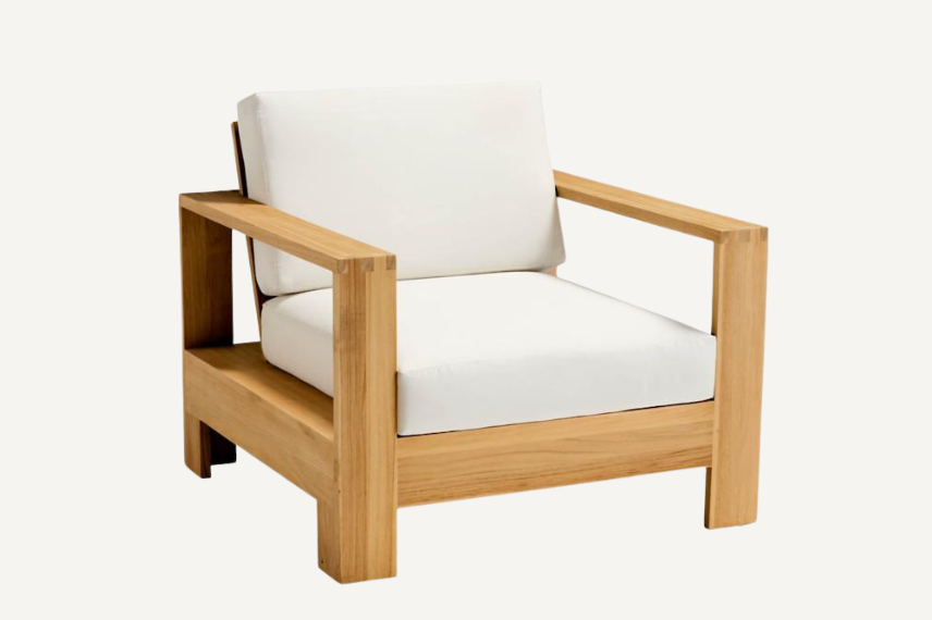 All weather outdoor lounge chair in natural teak. With its wide-plank arms and comfortably angled seatback, generous proportions with impeccable style.