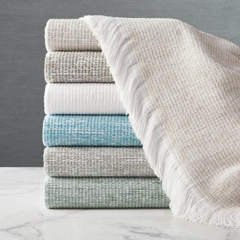 Crosshatch indoor/outdoor throw with white tassels in a range of colors 