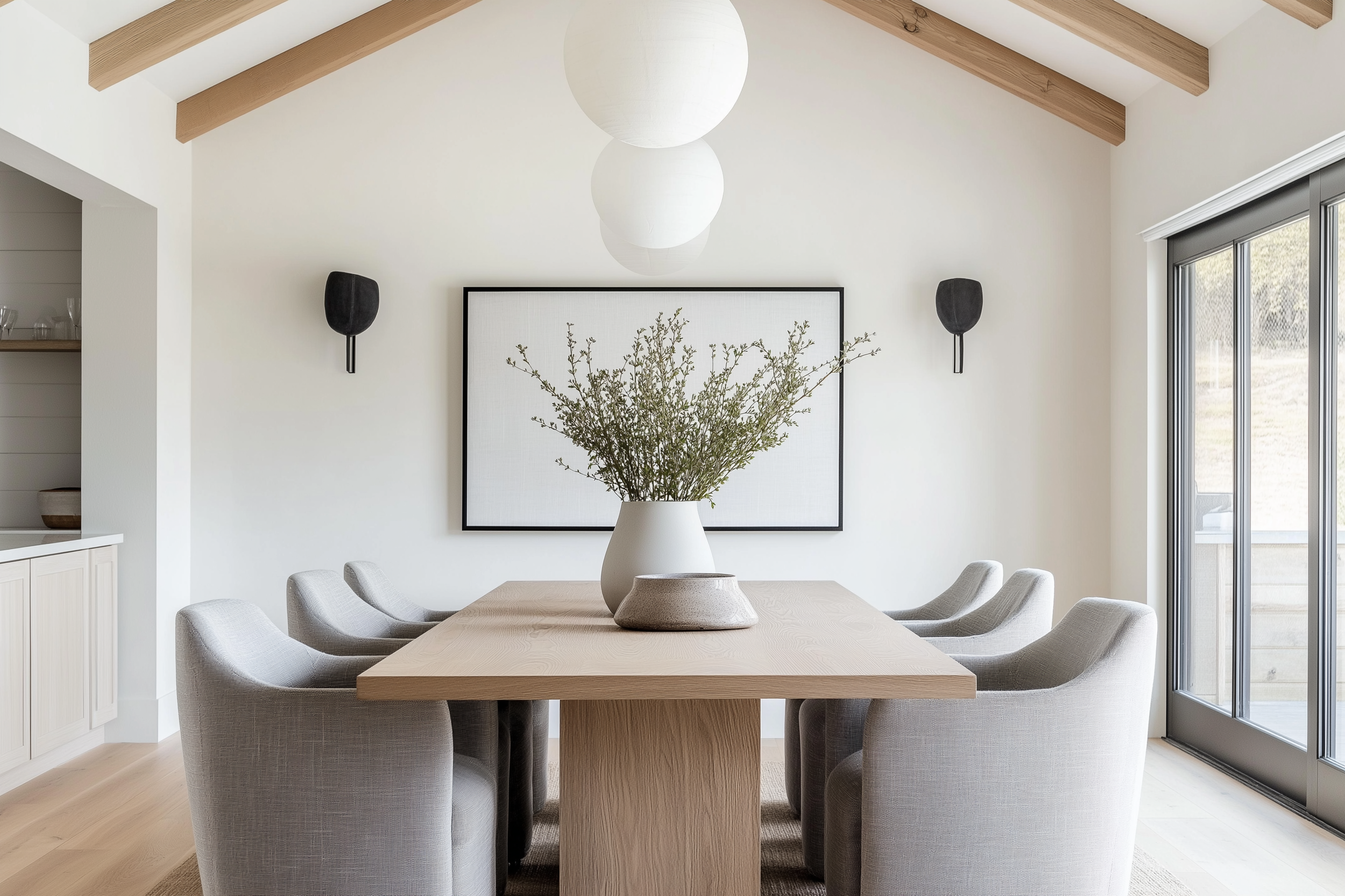 Bright and minimal barndominium dining room design with neutral decor and clean architectural lines.