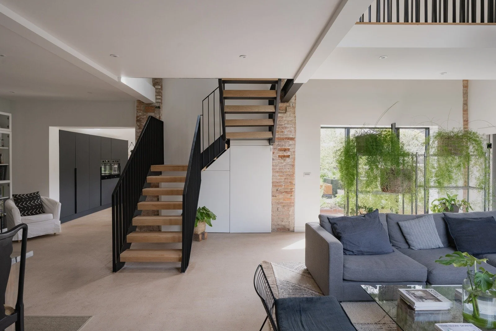 fen-barn-floating-staircase-and-open-plan-living-room.jpg