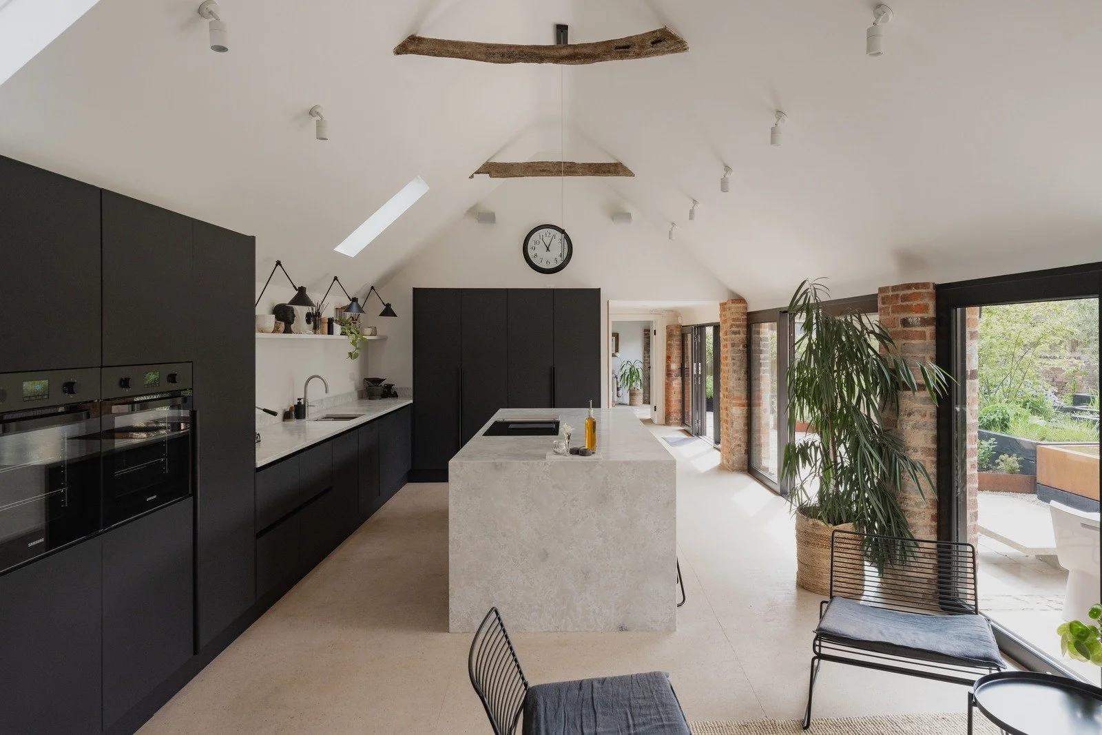 fen-barn-modern-kitchen-with-marble-island-and-exposed-beams.jpg