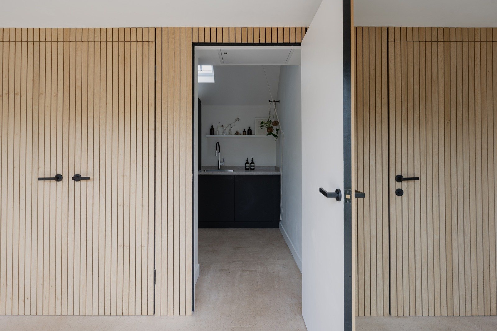 fen-barn-built-in-pantry-room-with-wooden-slatted-door.jpg