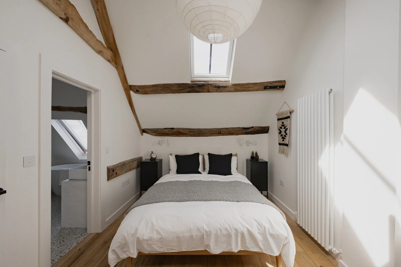 fen-barn-loft-bedroom-paper-lantern-skylight.jpg