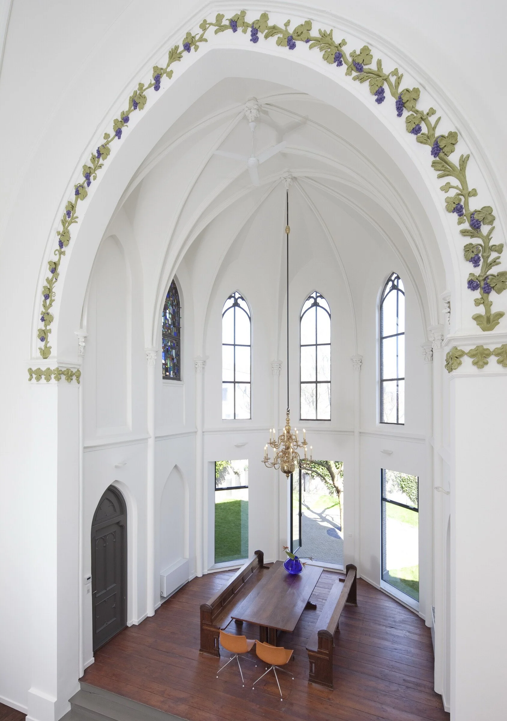 Modern dining room area built inside a freestanding structure within historic Dutch church