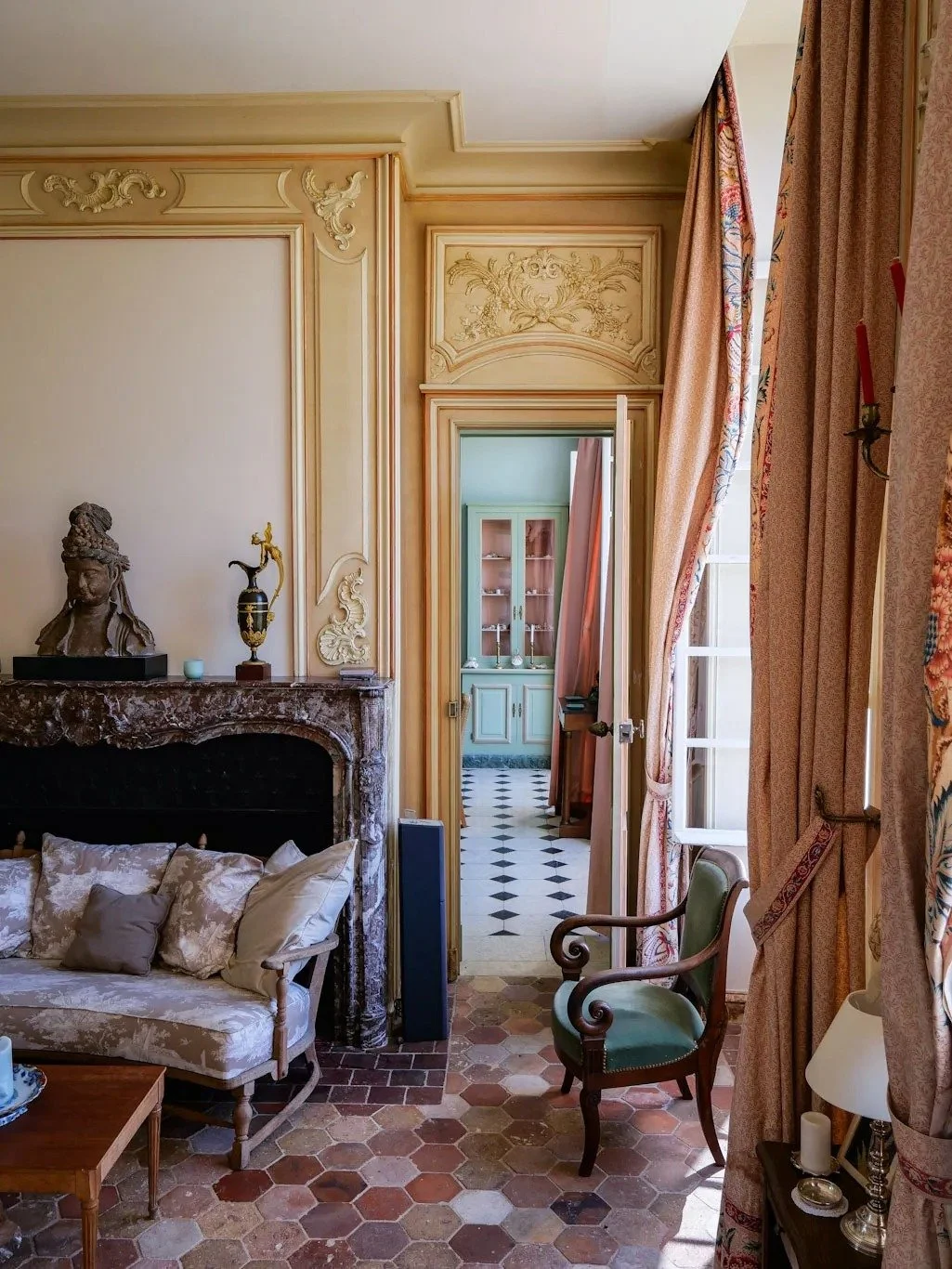 french-chateau-salon-with-marble-mantel-vintage-furniture.jpg