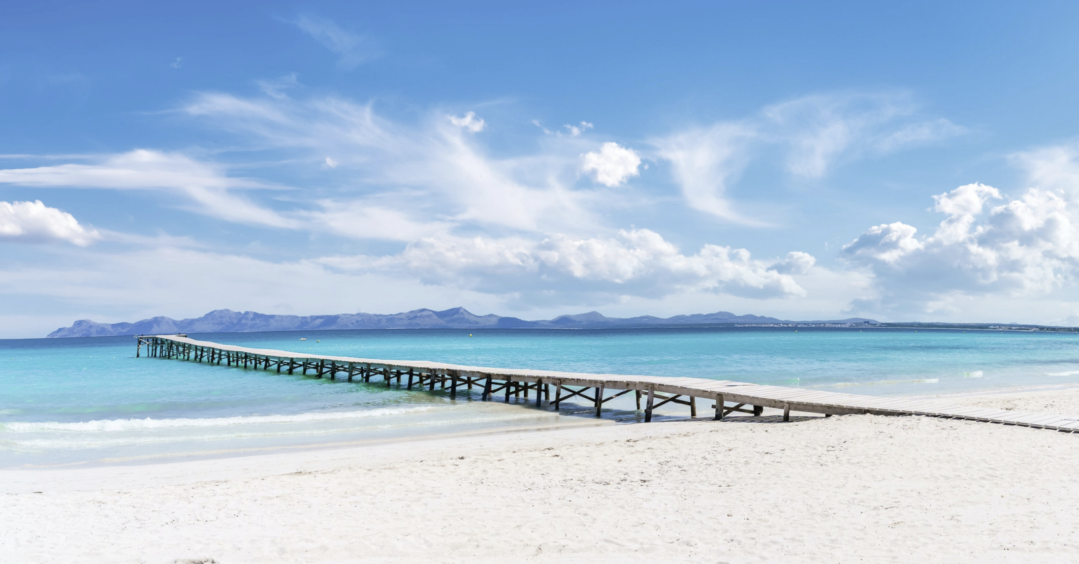 View of the blue waters of Playa del Muro beach