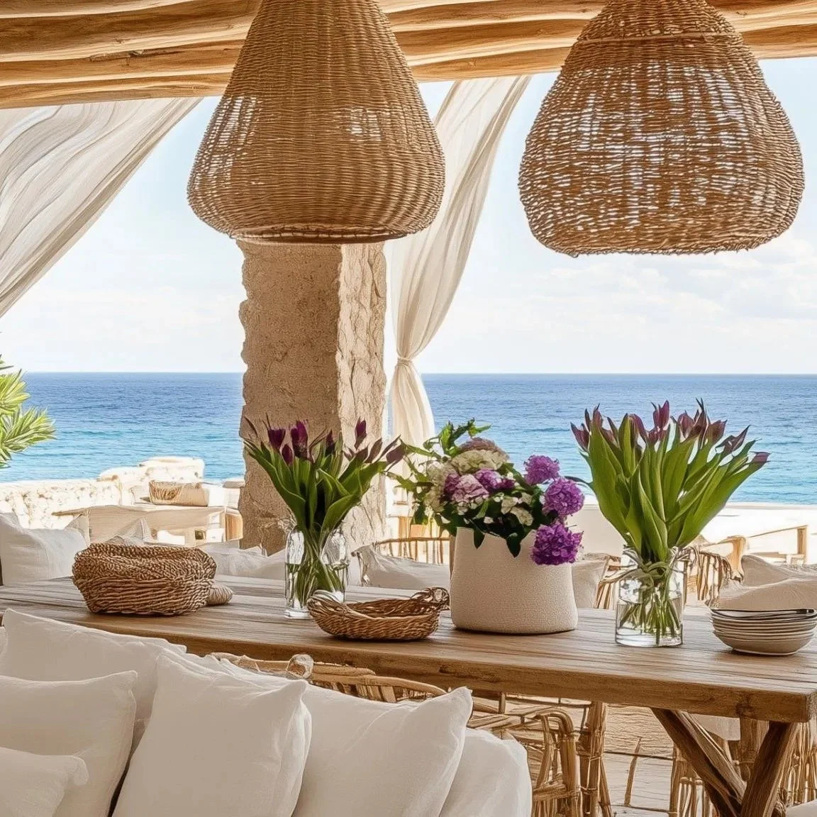 beachfront-dining-area-with-floral-decor-and-wicker-lanterns.jpg