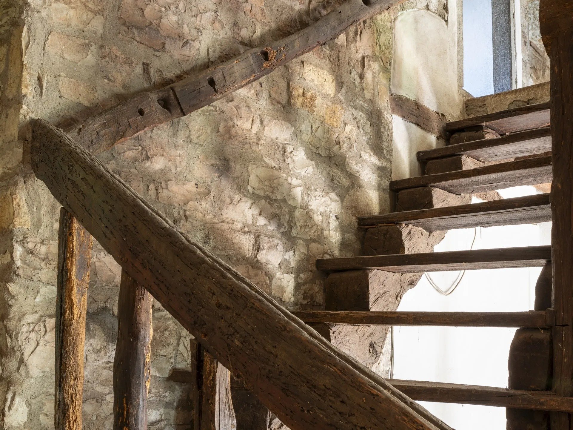 tuscany-rustic-staircase-exposed-stone-walls.jpg