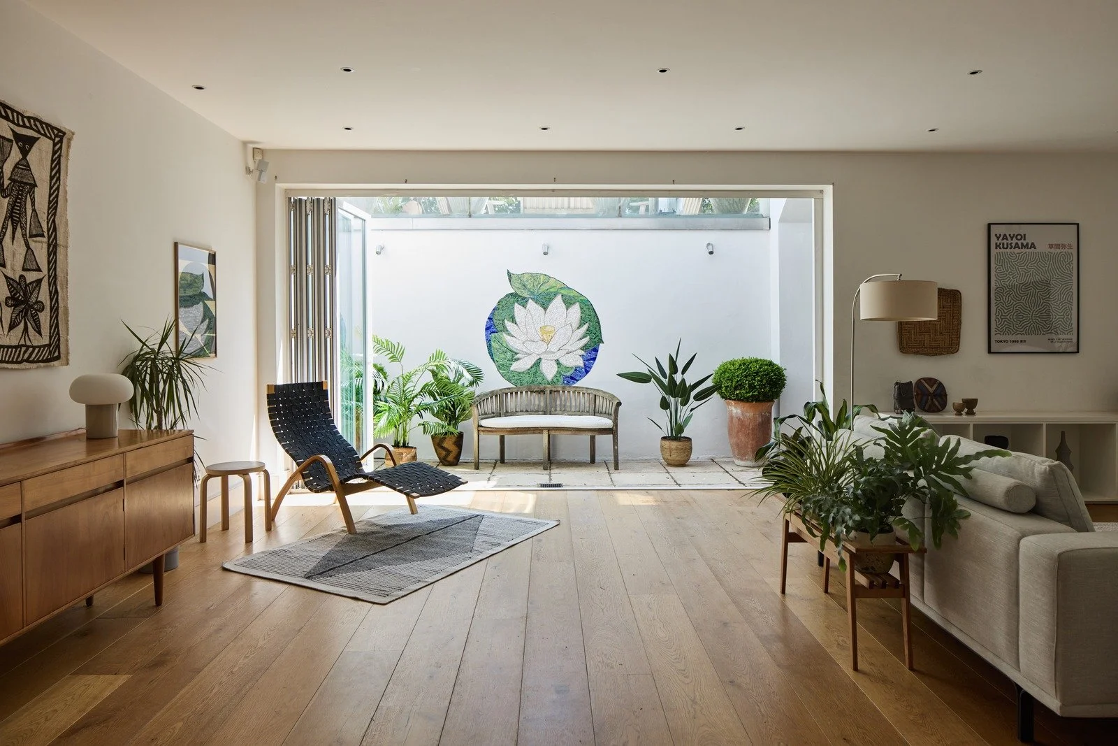 lower-ground-floor-modern-sitting-room-lotus-mosaic-wall-and-bi-fold-doors-london.jpg