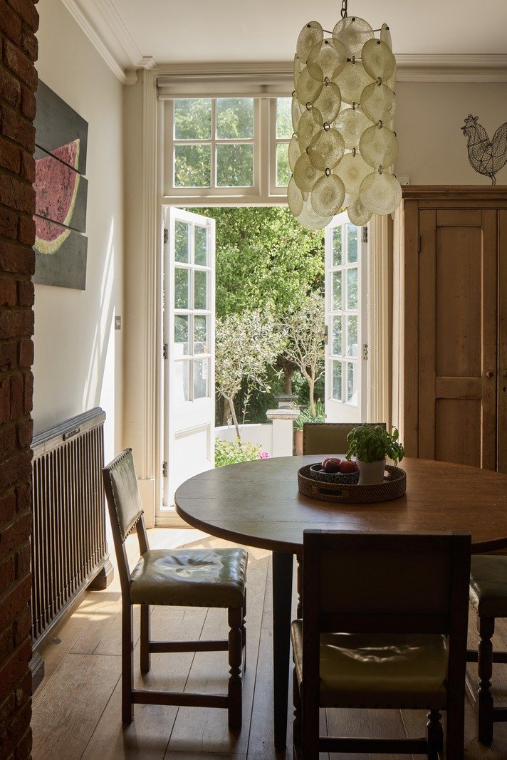 victorian-dining-nook-glass-doors-open-to-lush-garden-marble-light-fixture-london.jpg