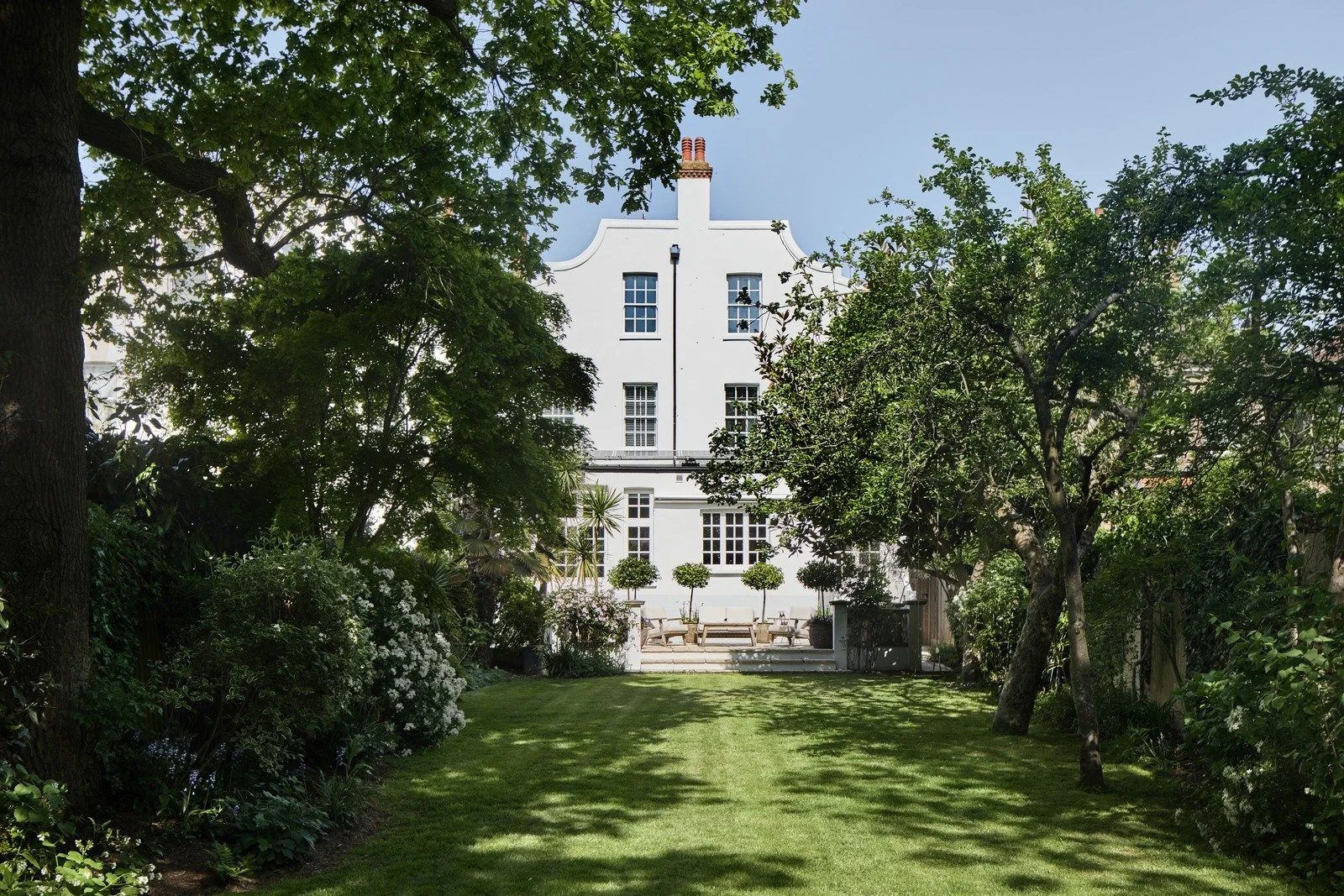 rear-elevation-of-victorian-townhouse-with-dutch-gable-and-formal-lawn.jpg