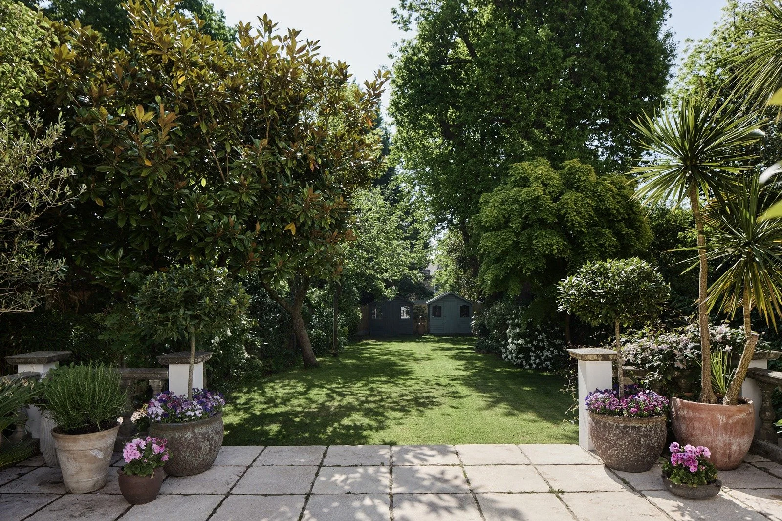 victorian-back-garden-with-lawn-flowerbeds-and-potted-plants-london-townhouse.jpg