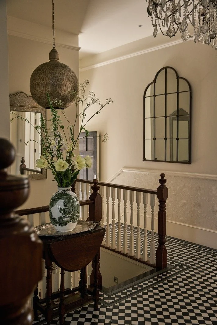 victorian-hallway-checkerboard-flooring-with-antique-mirror-and-chandelier.jpg