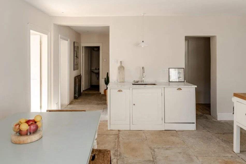 Downstairs kitchen area with original flooring