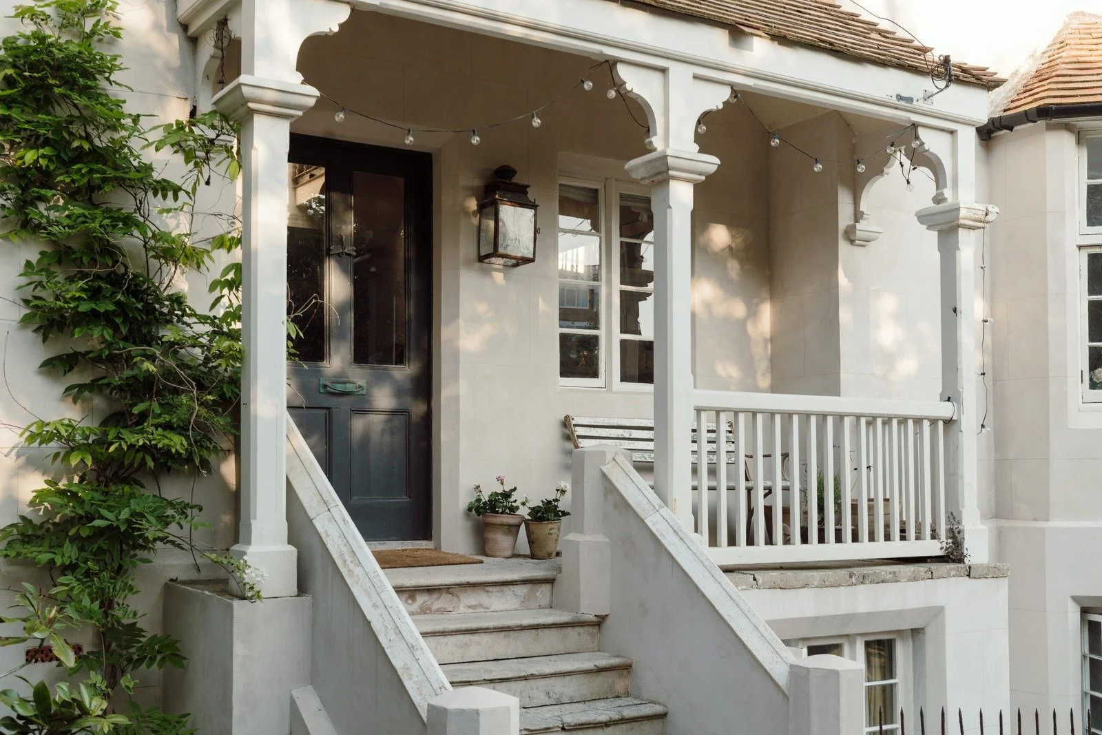 Steps to the front door entrance of this seaside Victorian home