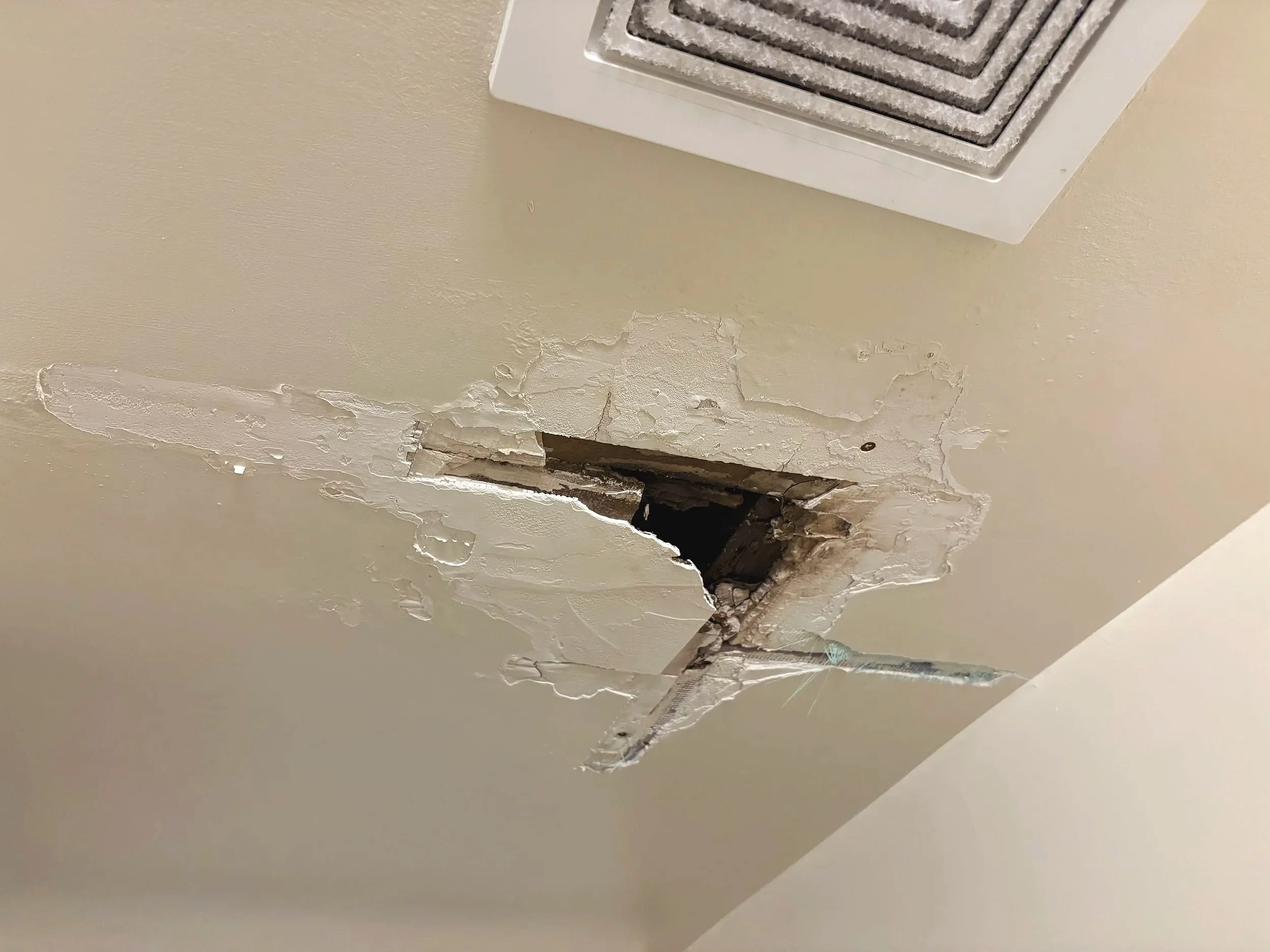 Water-damaged ceiling repair before 
seamless sheetrock patch
