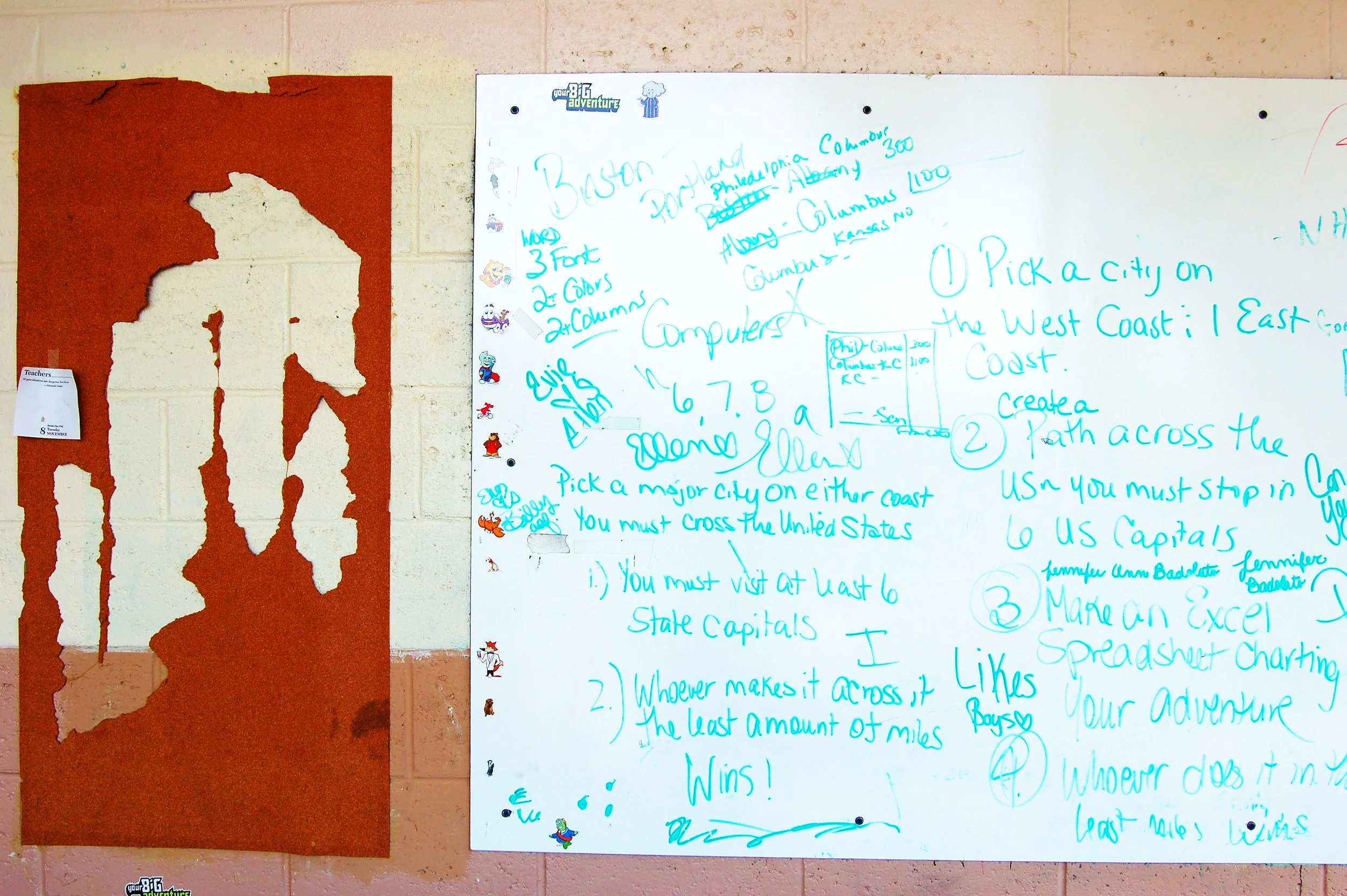 Whiteboard with handwritten instructions and notes, decorated with small cartoon stickers of animals. To the left, a torn red poster on a beige brick wall.