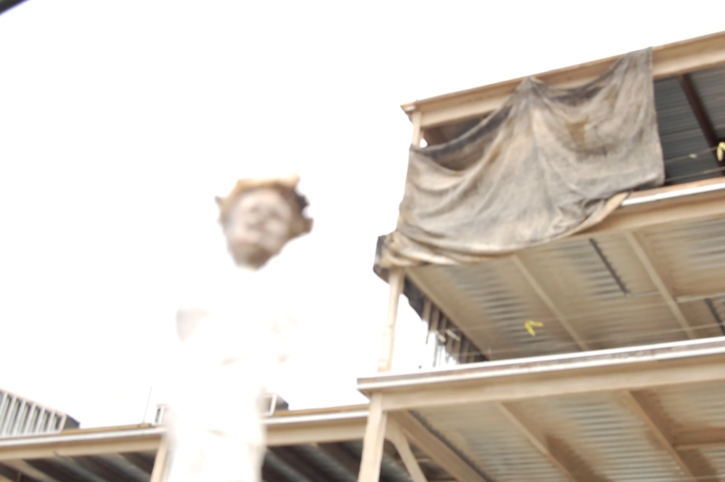 Figure in front of a construction site.