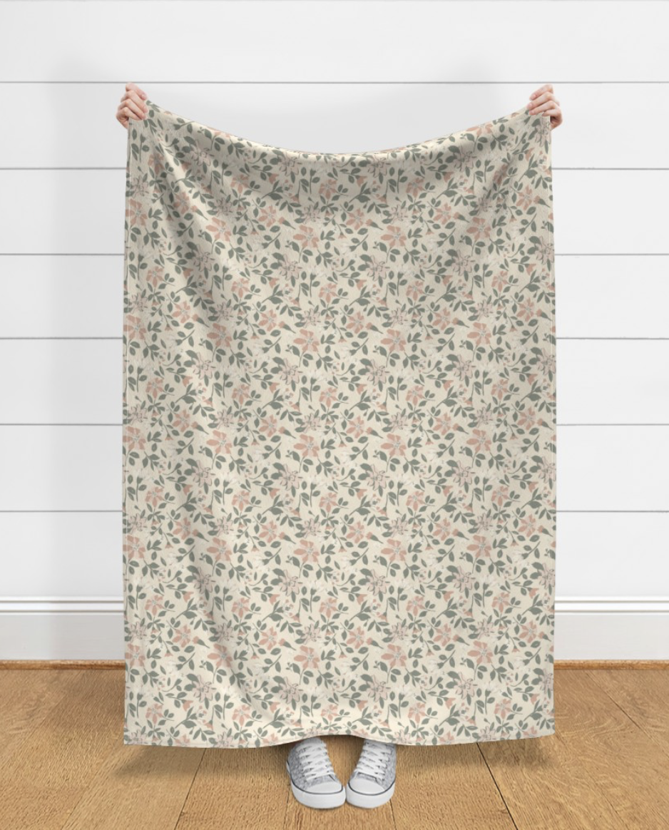 Person holding up a floral curtain or fabric with Spring emergence blossoms Emily Maria Studios