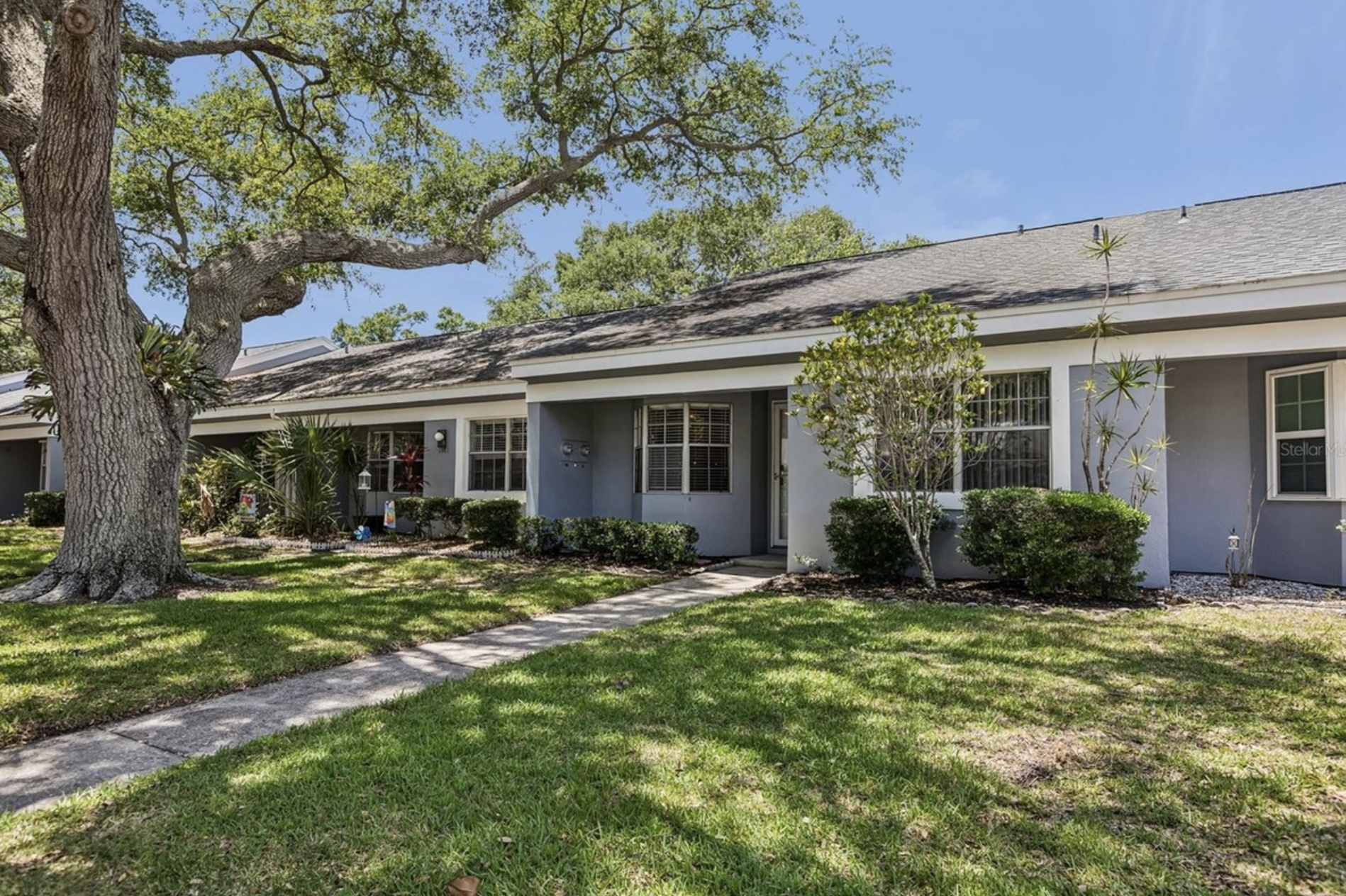 The Villa @ Safety Harbor Front is the second villa from the end. Located on a dead-end street, the 2 assigned parking spaces are directly in front of unit. The villa is beautifully surrounded by small shrubs, large trees, and a well-maintained green