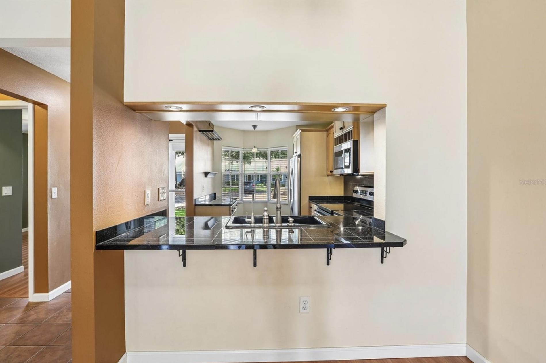 The open breakfast counter is perfect for eating and conversing.