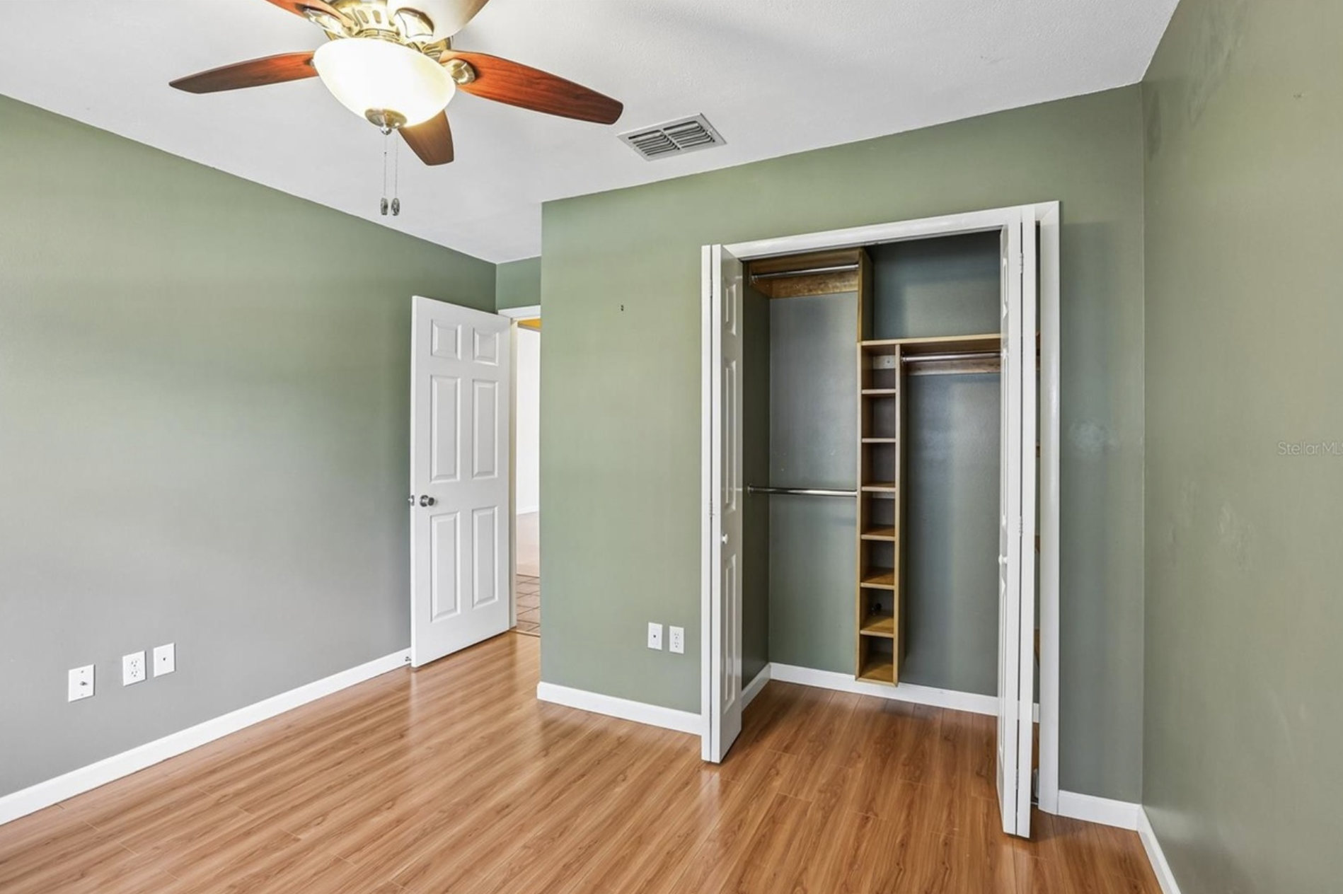 Bedroom #2 has a ceiling fan, walk-in closet, and closet organizers.