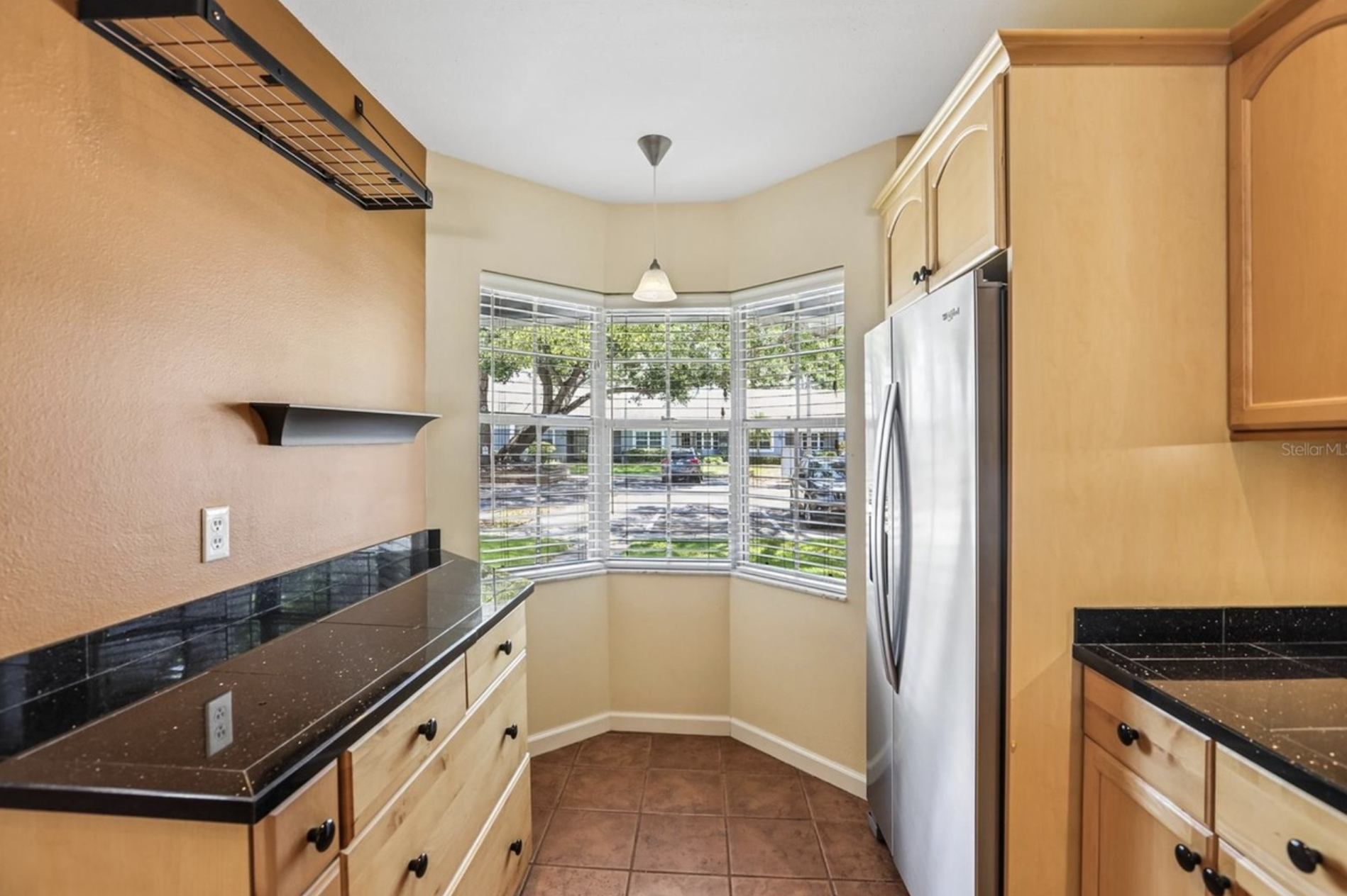 The kitchen has a gorgeous view of the front of the villa with plenty of storage space.