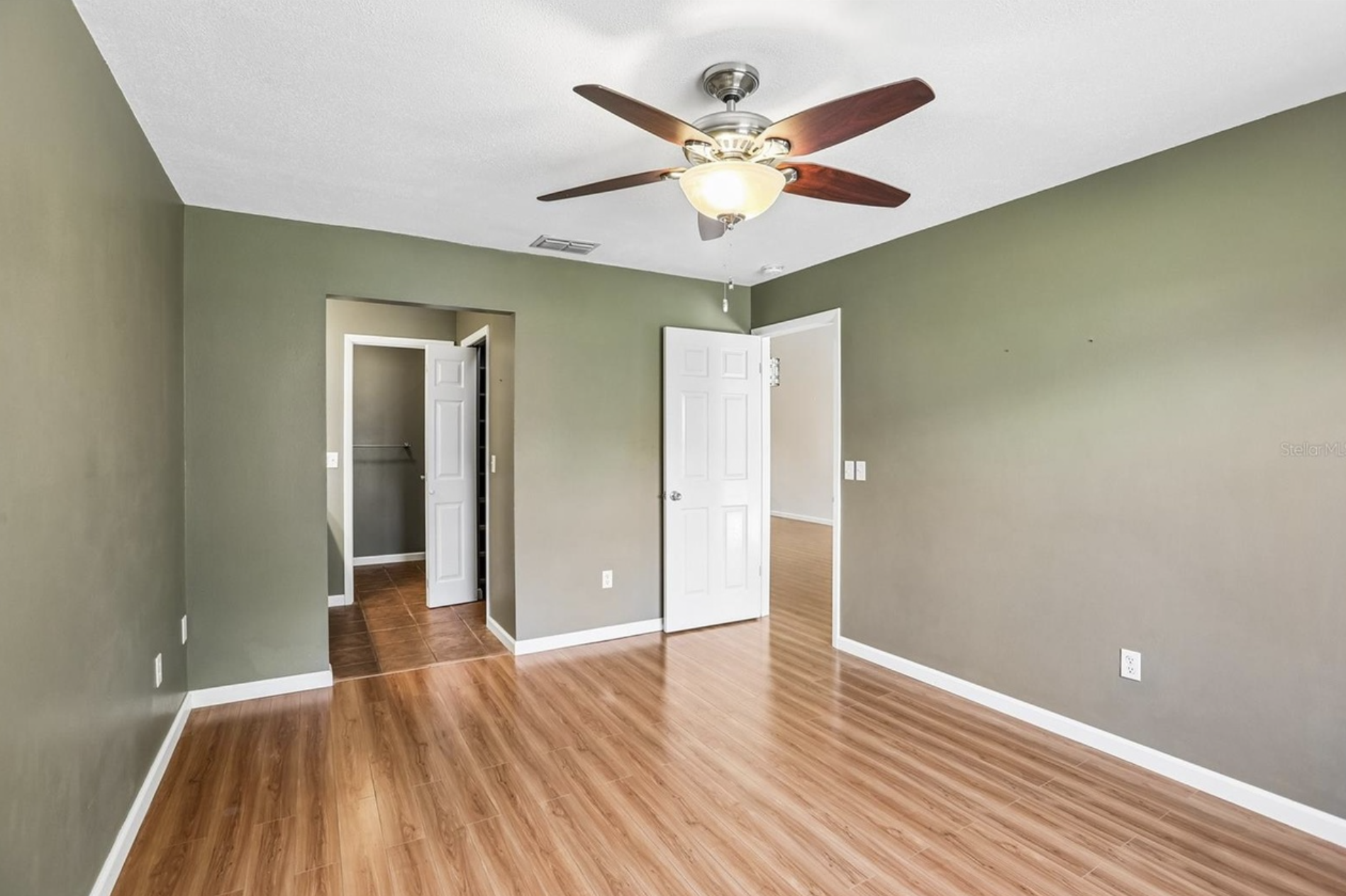 Each bedroom has a private bathroom, ceiling fan, and closet organizers.