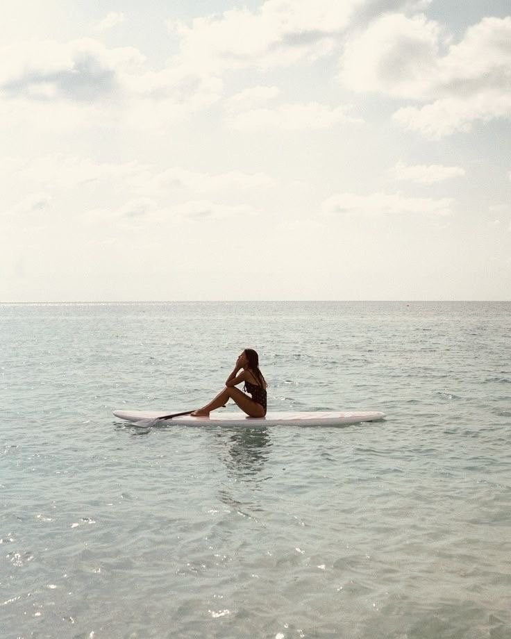 Luxury Caribbean vacation experience with woman paddleboarding in the Dominican Republic.