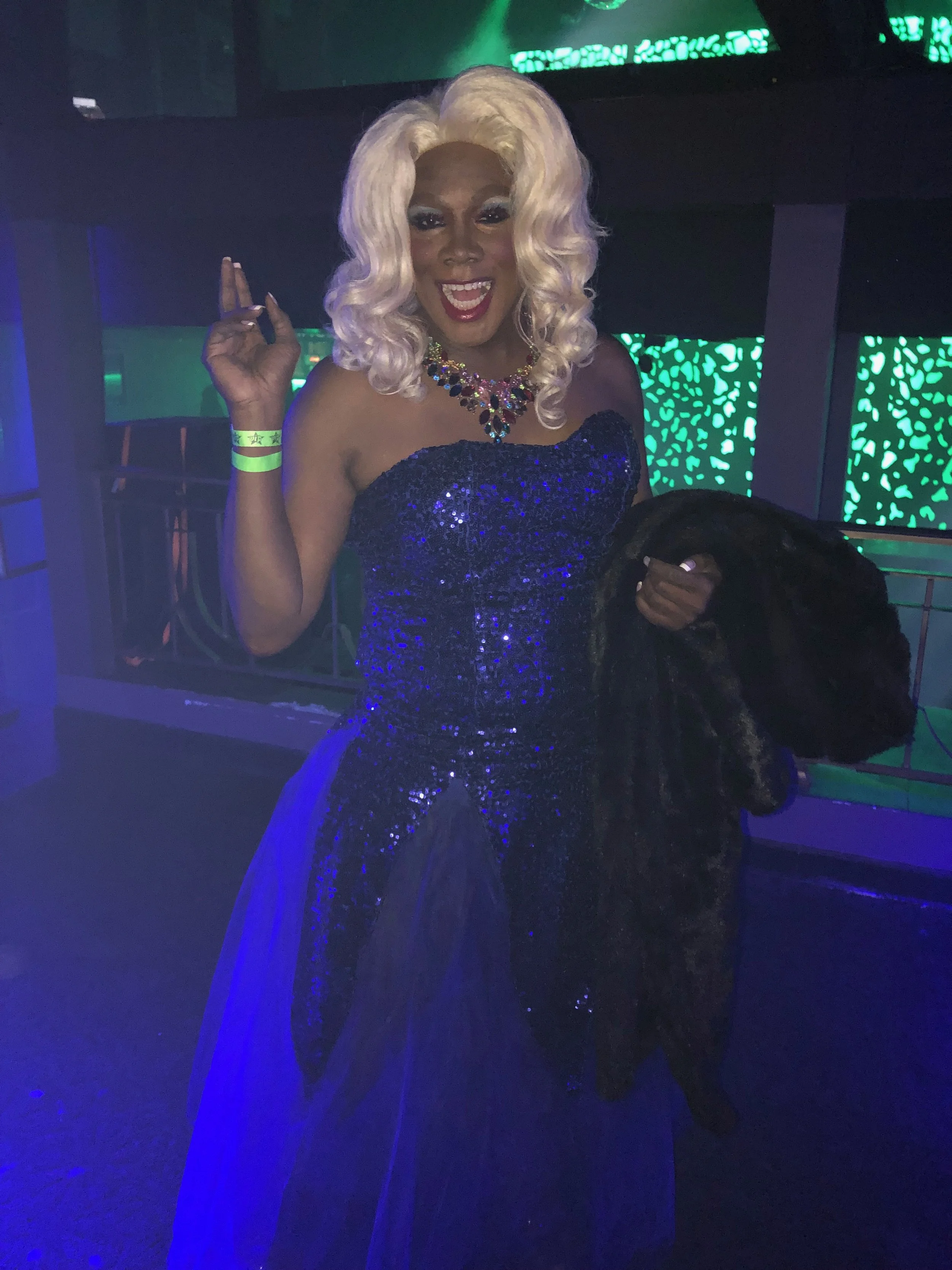 A'Freeka Nature performing in a blue sequin gown at a live event