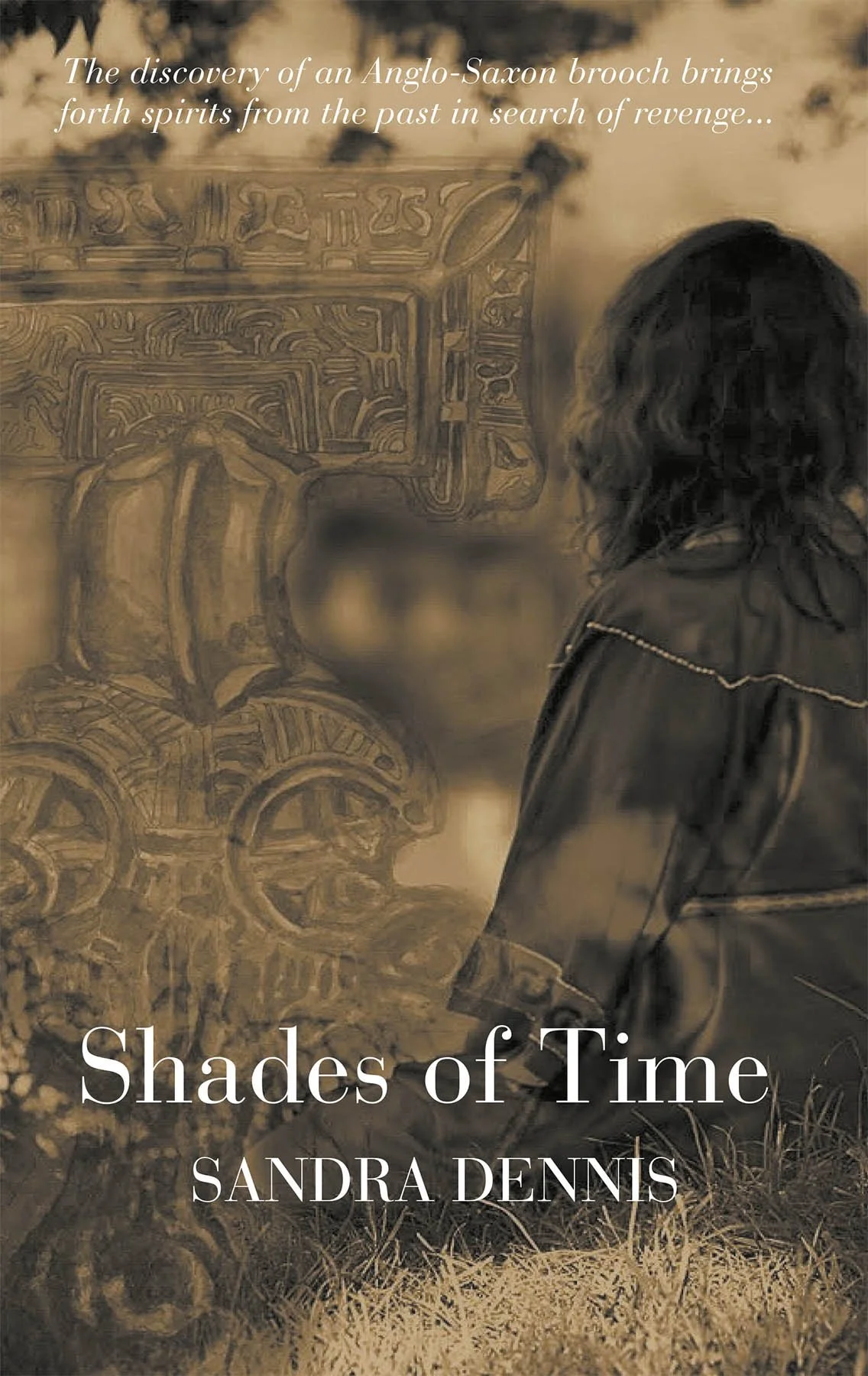 Sepia-toned book cover titled "Shades of Time" by Sandra Dennis. Features an illustration of an Anglo-Saxon brooch and a woman with long, dark hair in a field.