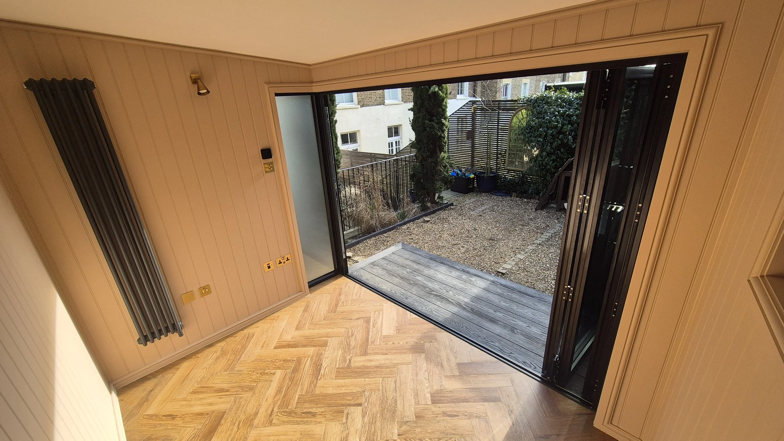 Millboard Board & Batten Composite Cladding in London Garden Room.jpg