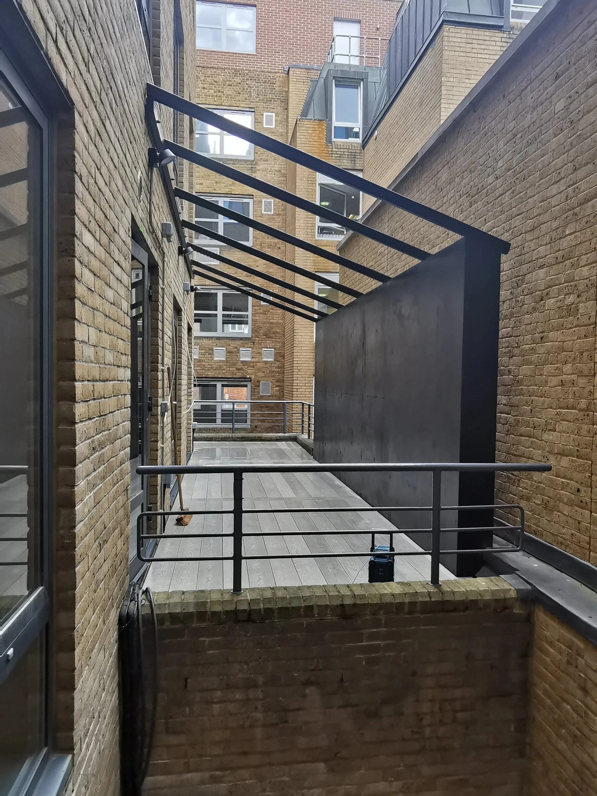 Millboard Decking, Steel Pergola & Privacy Screen Central London.jpg