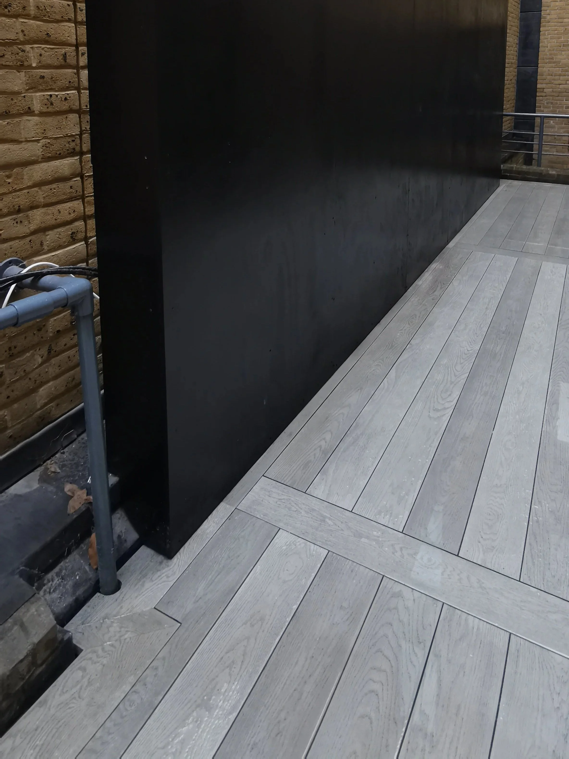 Millboard Decking, Steel Pergola & Privacy Screen Central London.jpg