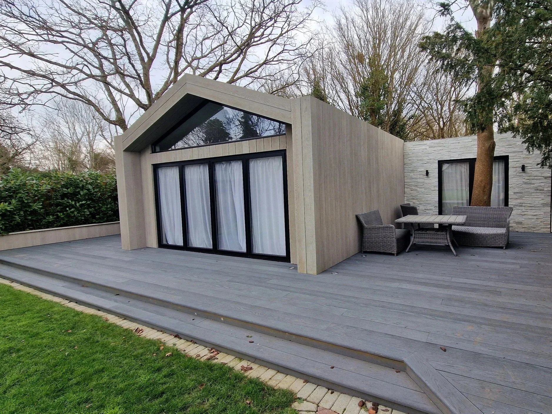 Bespoke garden room with Millboard decking London - Decking Gurus.jpg