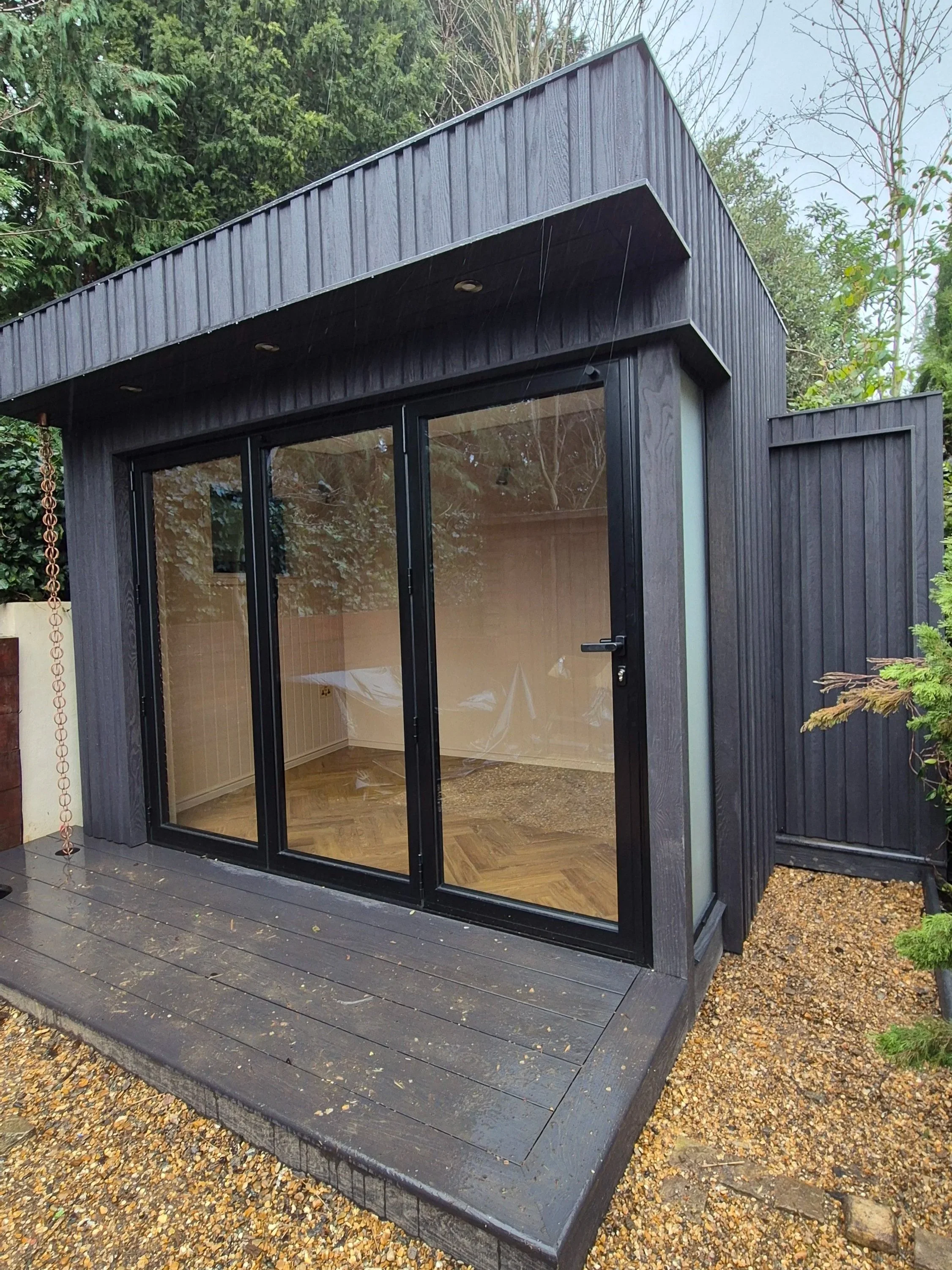 Millboard Board & Batten Composite Cladding in London Garden Room.jpg