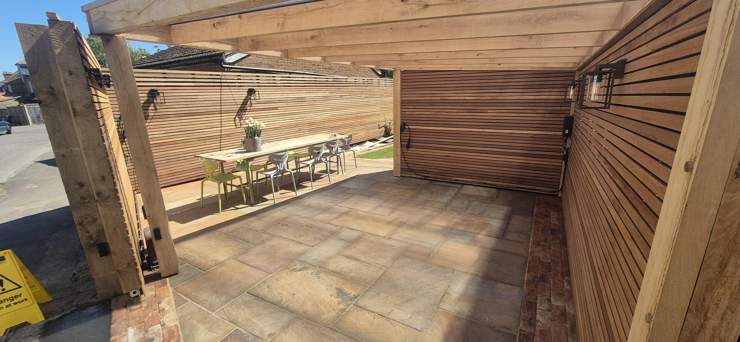 Hardwood Slatted Fencing, Sandstone Patio, Herringbone Brick Path & Millboard Decking