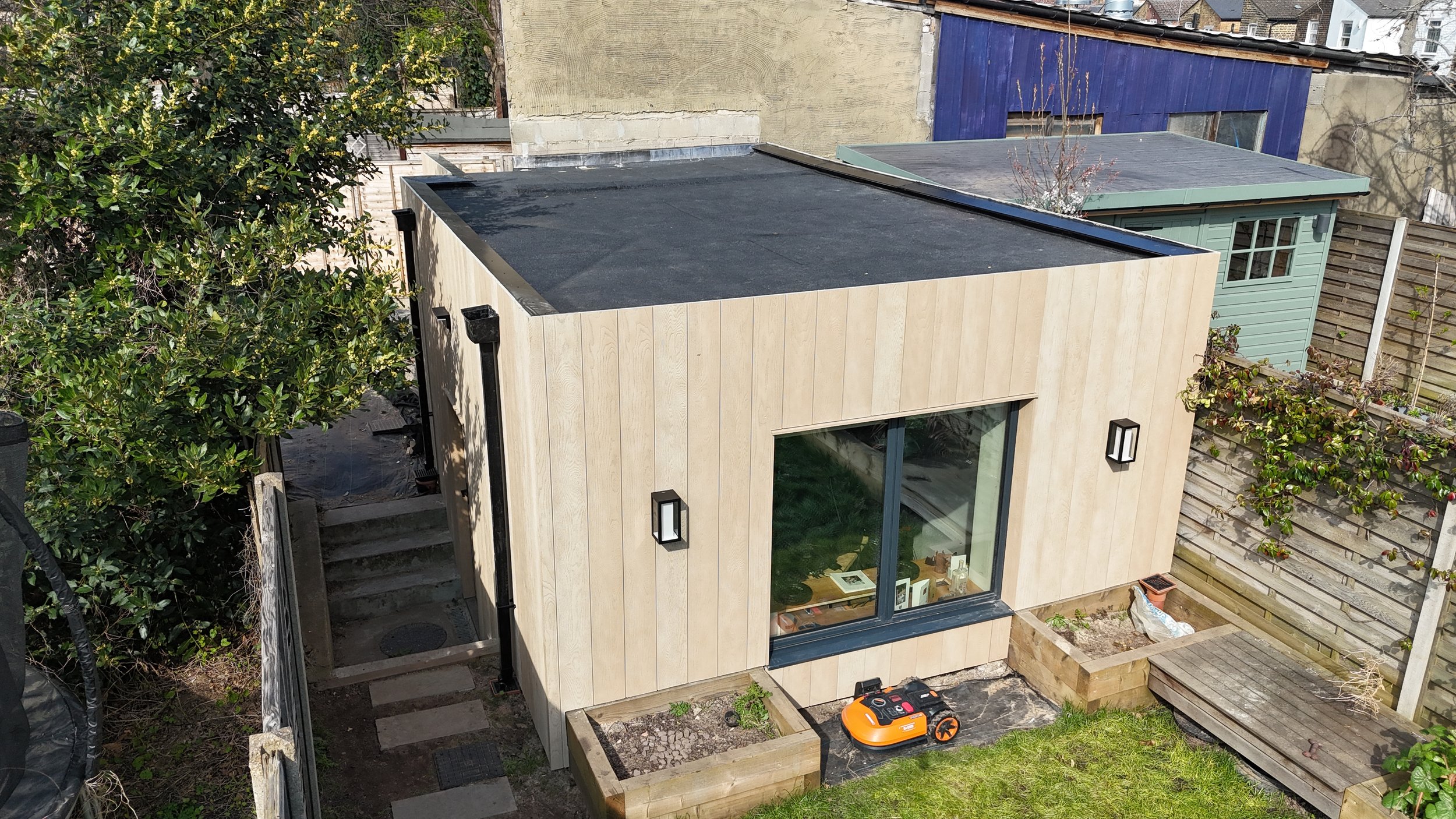 Millboard Envello Cladding in Golden Oak London.JPG