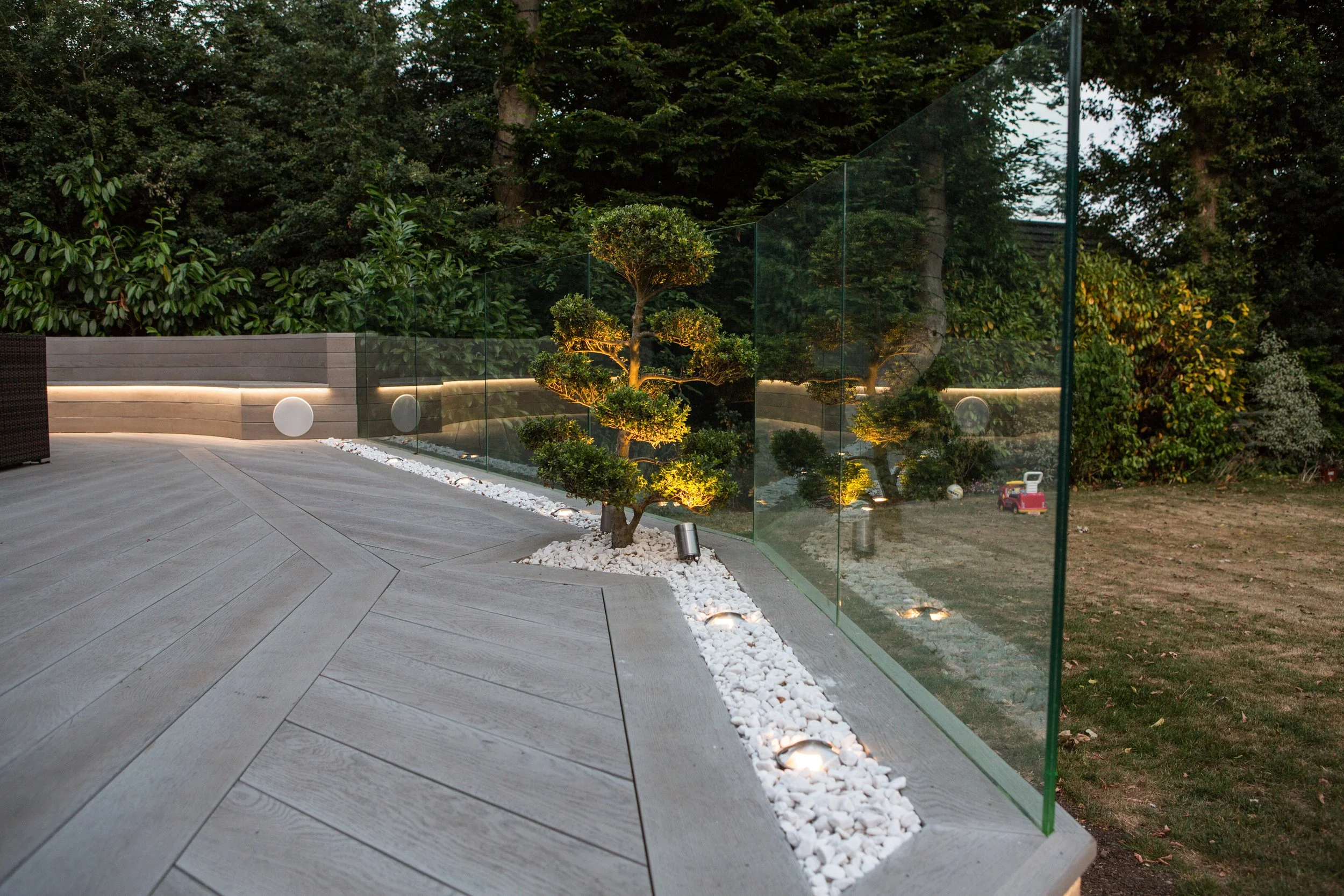 Curved composite decking with metal railings Essex