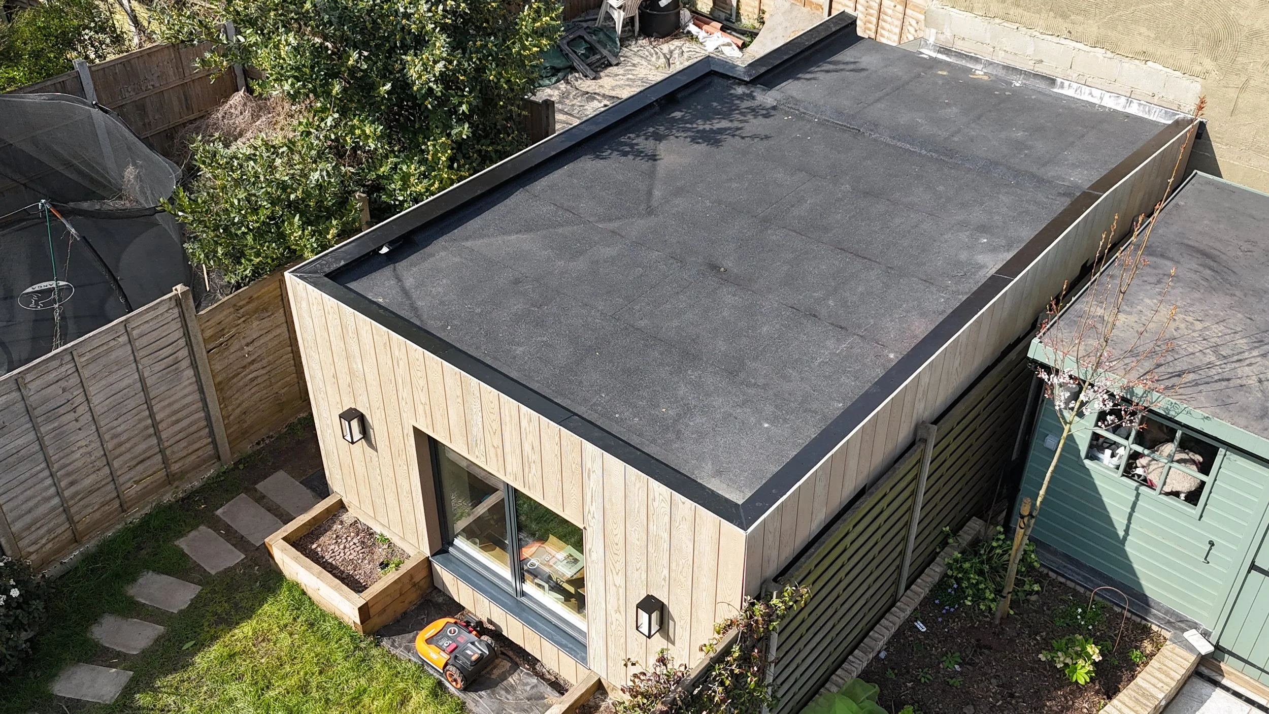 Millboard Envello Cladding in Golden Oak London.JPG