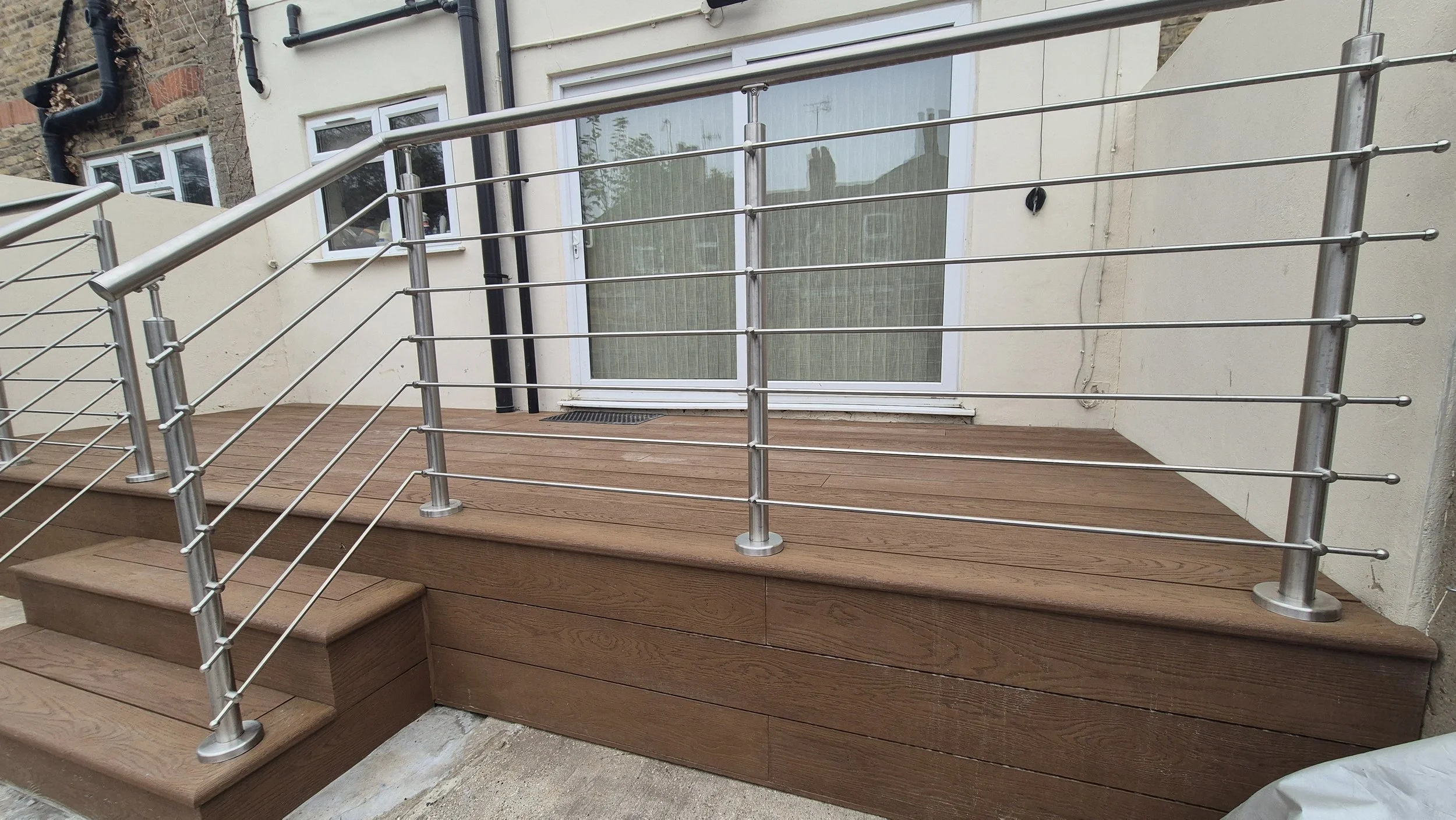 Coppered Oak Millboard Decking with Stainless Steel Handrails in London