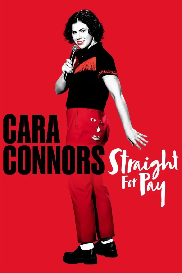 A woman with curly black hair, smiling, holding a microphone, wearing a black top with red fringes on the sleeves, red pants with white patches, standing against a red background. The text on the image reads 'CARA CONNORS Straight For Pay'.